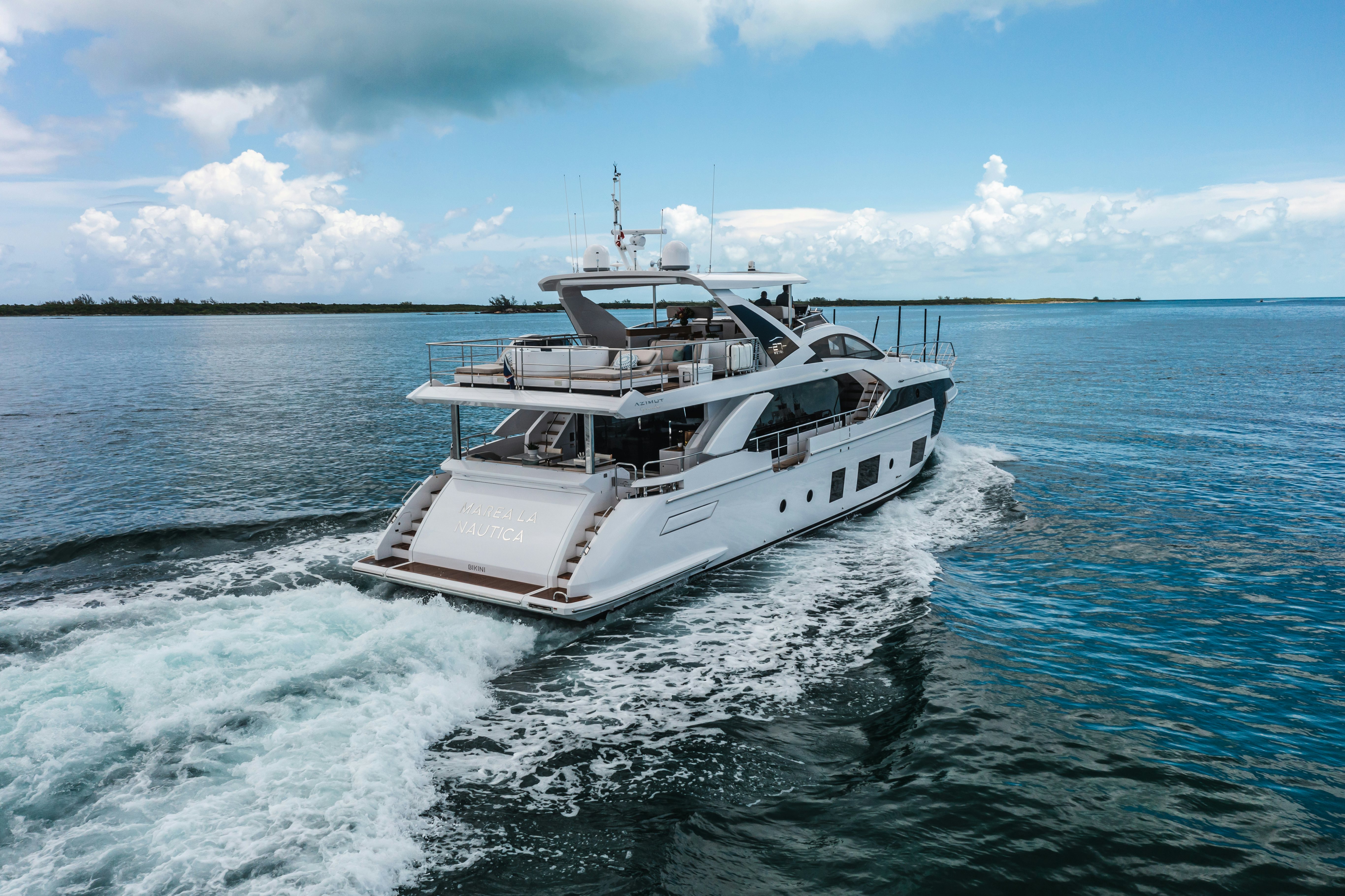 MAREA LA NAUTICA cruising away from the camera in the blue ocean