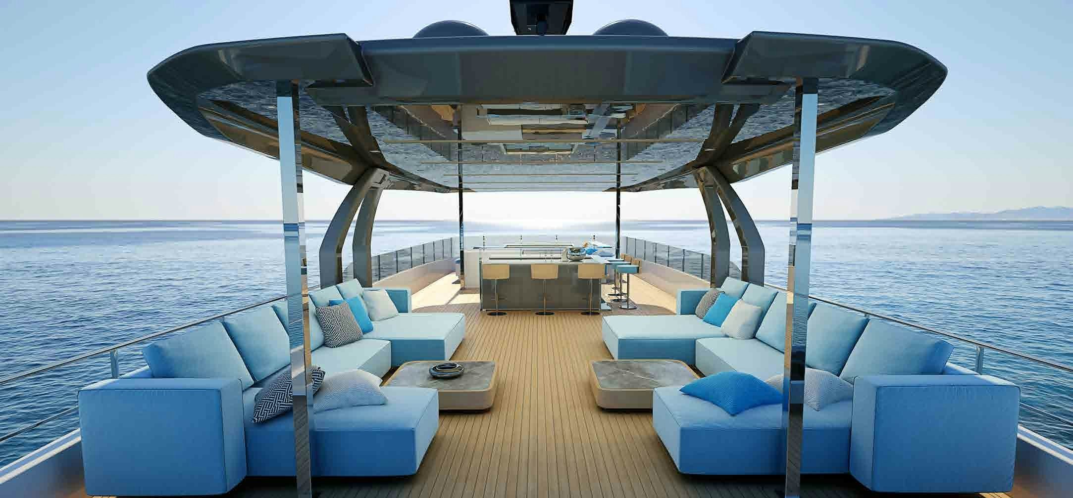 Custom Line Navetta 42 - Serene Sky Lounge An inviting outdoor sky lounge on the Custom Line Navetta 42 with plush blue sofas and panoramic ocean views.