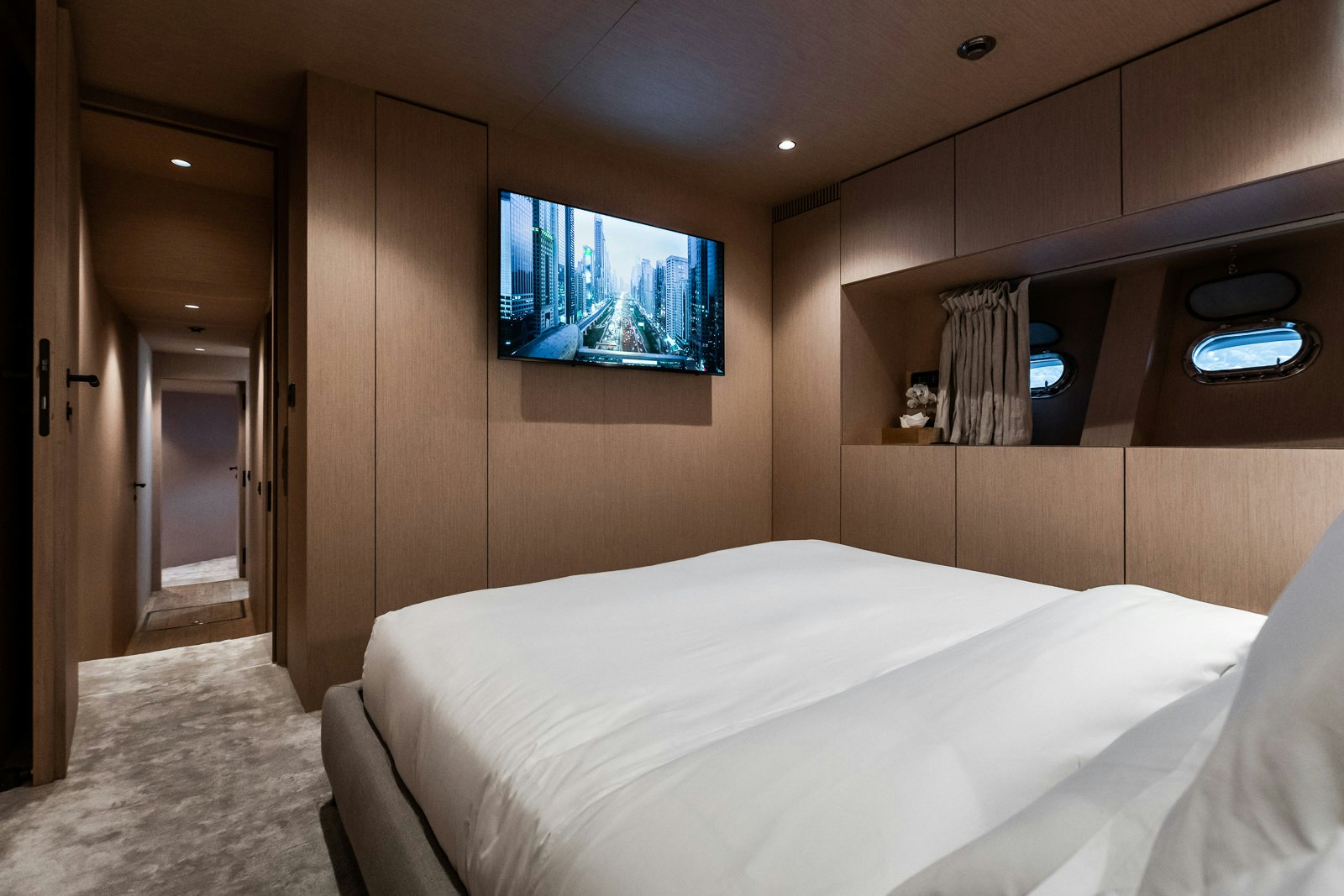 The master suite on the Mangusta 108 yacht, combining plush comfort with sleek, modern aesthetics.