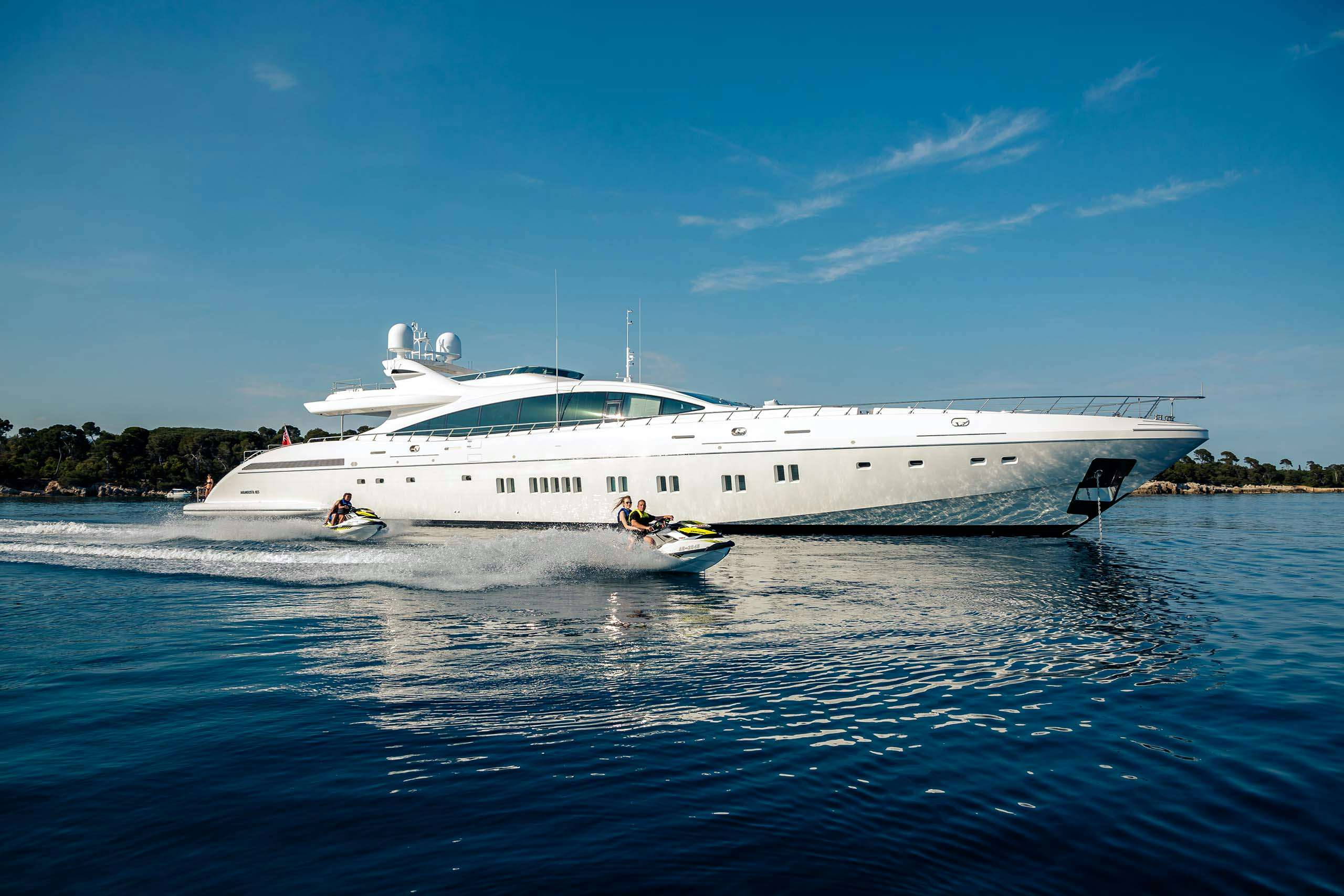 100 feet yacht for charter cruising the mediterranean alongside jet skis