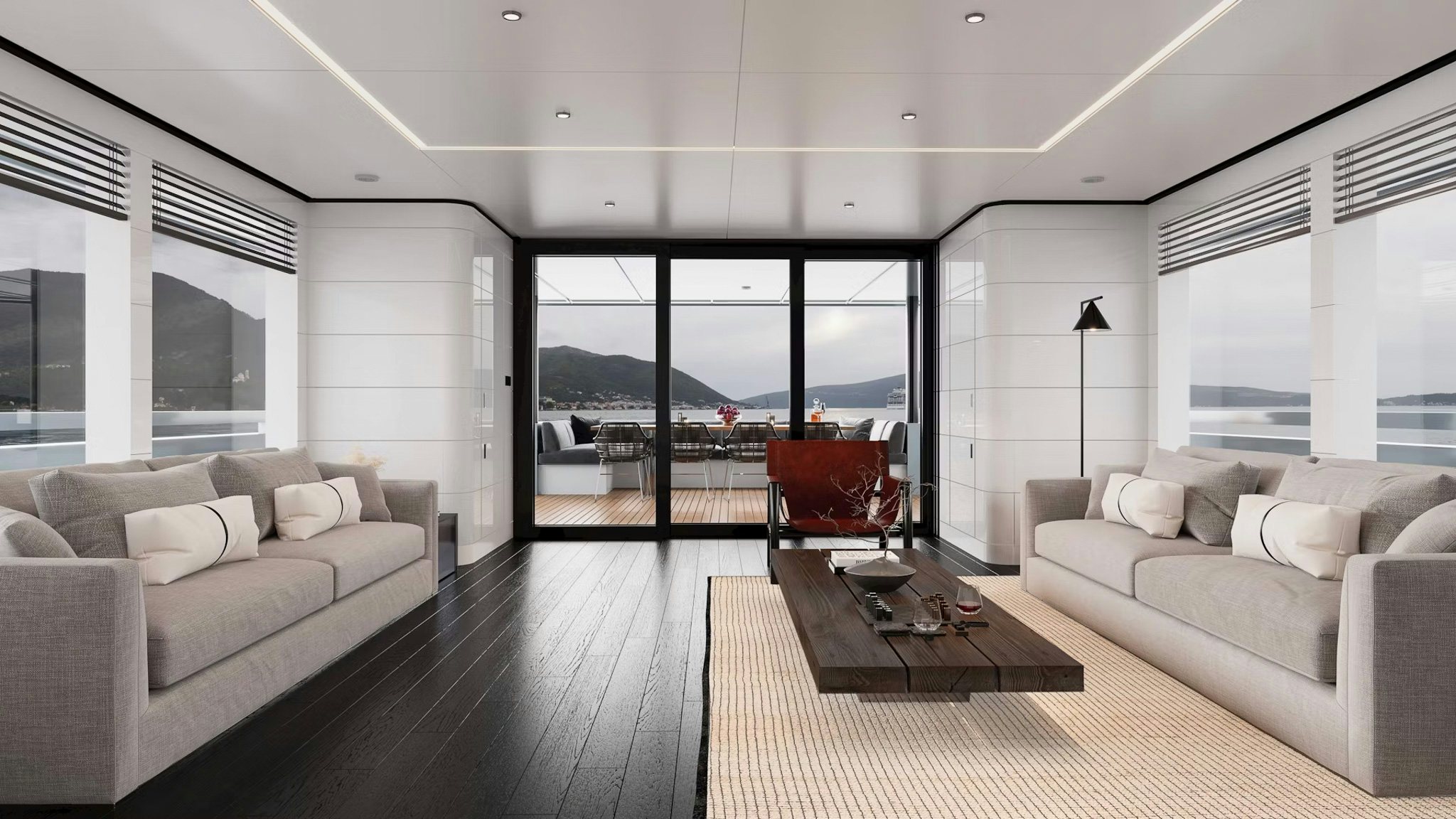 Main salon of PROJECT MAKO SHARK with panoramic views and aft deck dining area