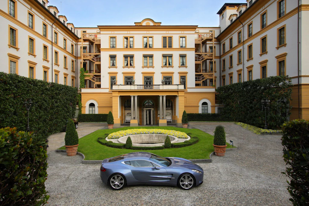 car in front of mansion