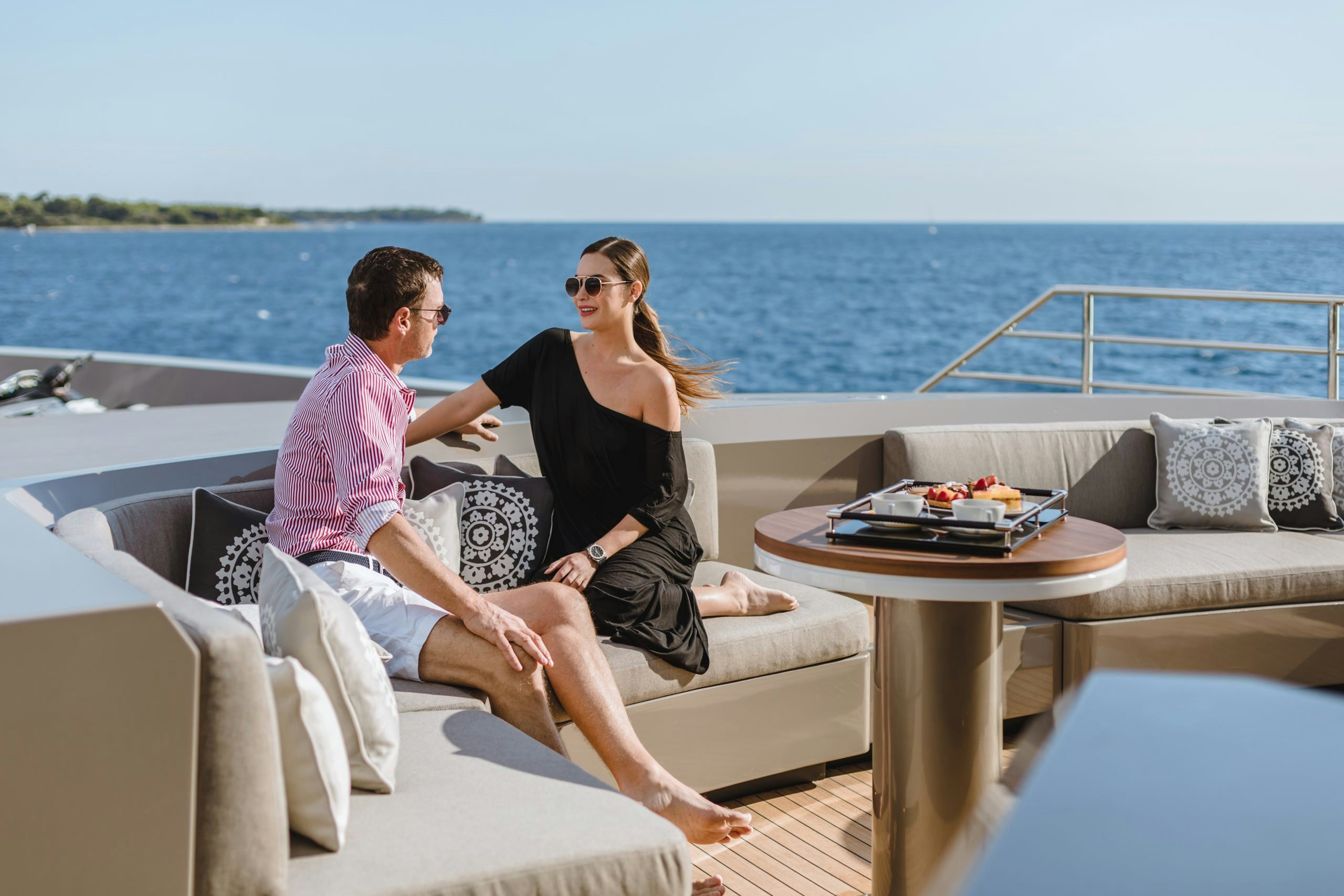 model couple relaxing on a private Bahamas yacht charter