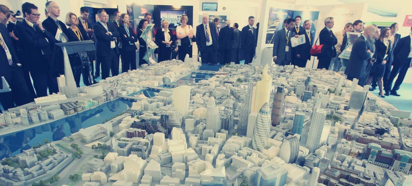 An intricate scale model of a city on display at MIPIM 2024. Charter a Northrop & Johnson yacht for an exclusive event experience.