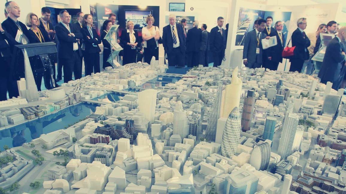 An intricate scale model of a city on display at MIPIM 2024. Charter a Northrop & Johnson yacht for an exclusive event experience.