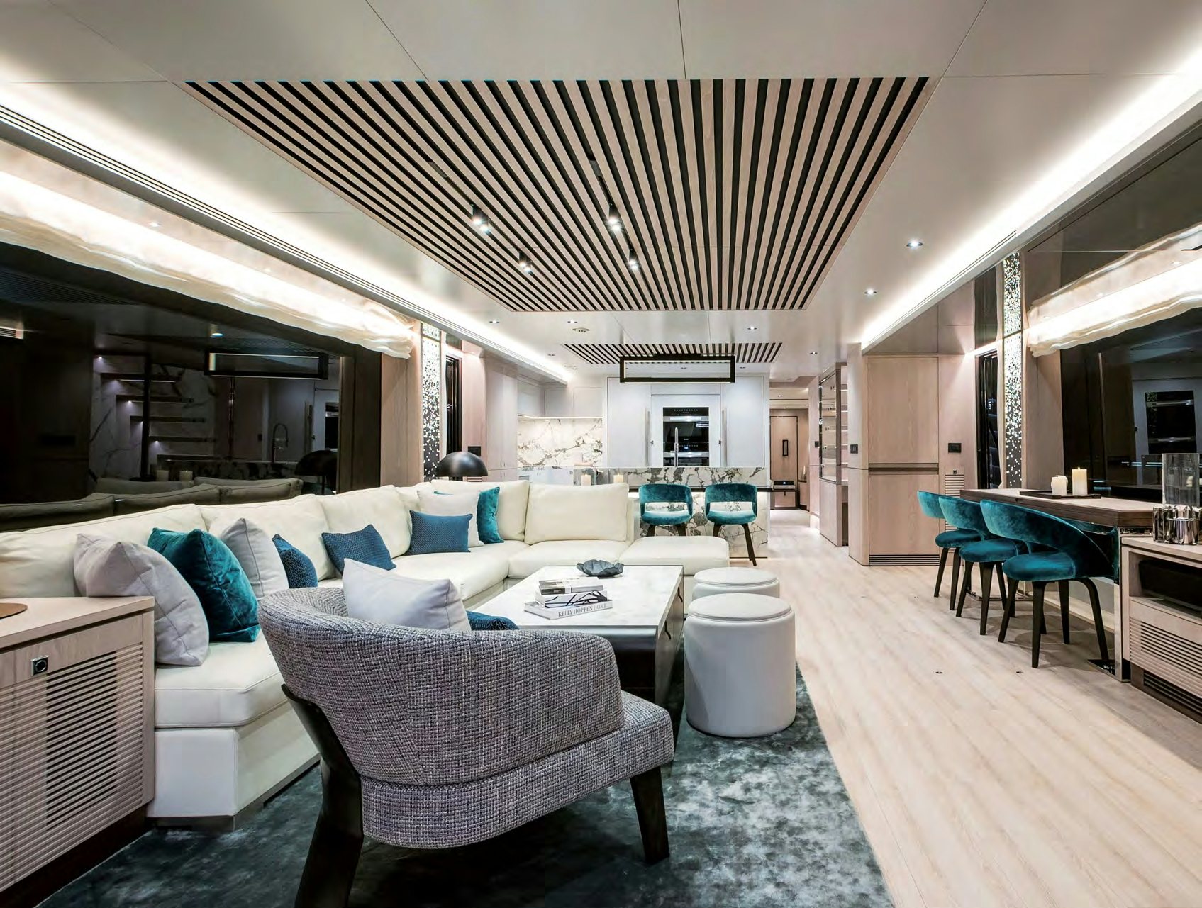 The luxurious modern interior of the Horizon FD 80 yacht, featuring a spacious salon and kitchen area.