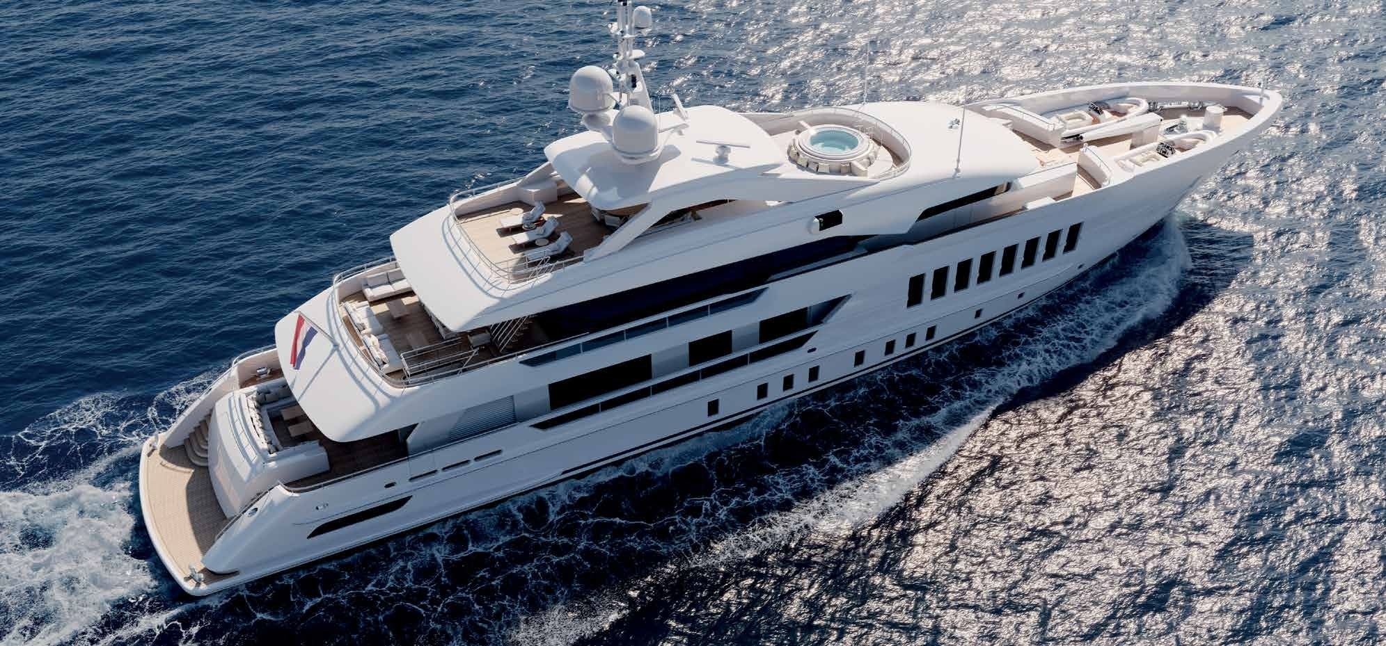 Aerial view of the Heesen 55 Steel yacht cruising, highlighted by Northrop & Johnson.