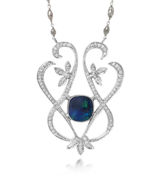 Just Jules black opal necklace surrounded by a rose-cut diamond enhancer