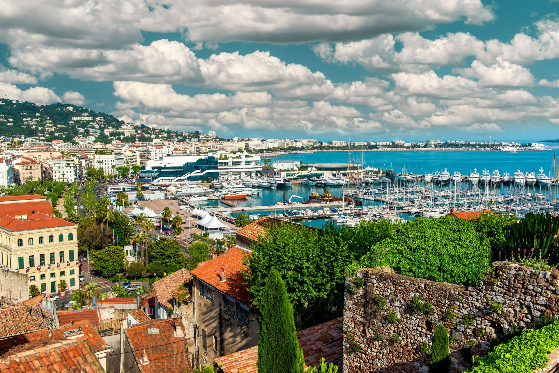 CANNES YACHTING FESTIVAL aerial shot of the stunning city of Cannes in the French Riviera with yachts and boats in the water