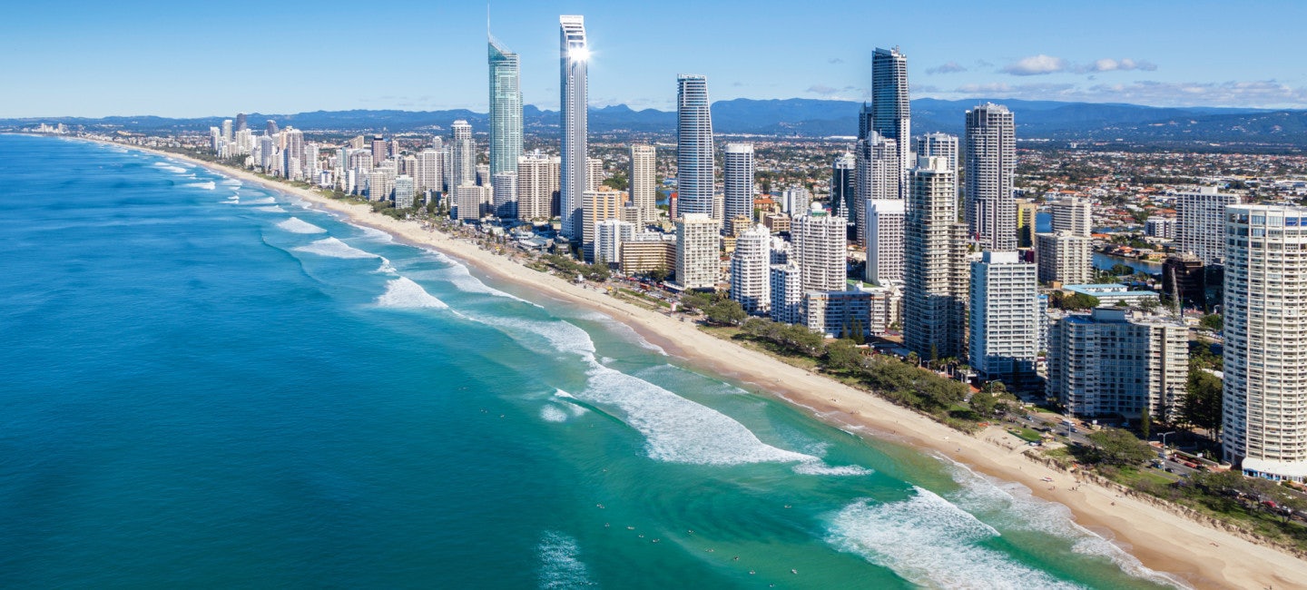 A breathtaking aerial view of the coast and skyline during the sunny day at the Sanctuary Cove International Boat Show
