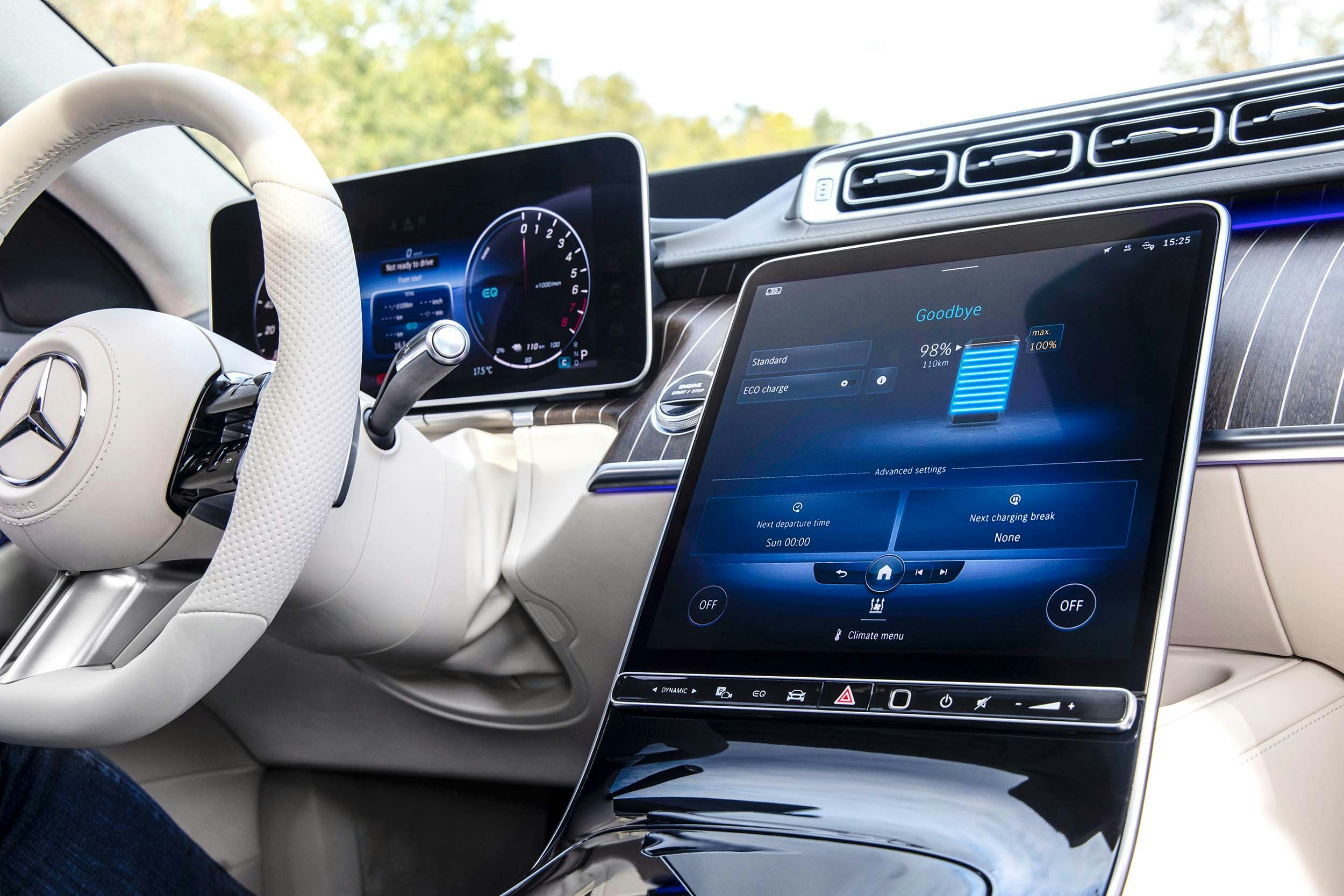 Mercedes-Benz S-Class interior close up of the modern technological dashboard with white leather steering wheel and touch screen controls