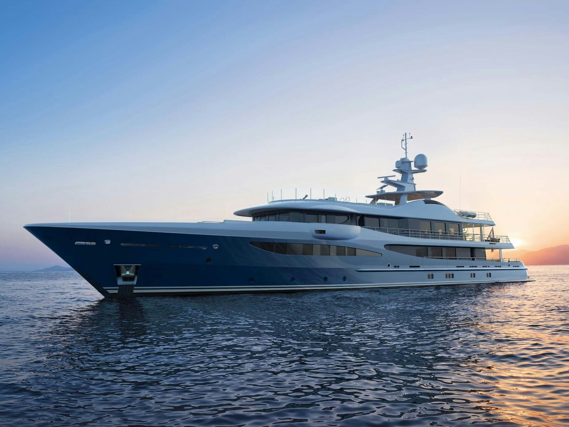 The Amels 180 Superyacht basks in the golden light of sunset on calm seas.