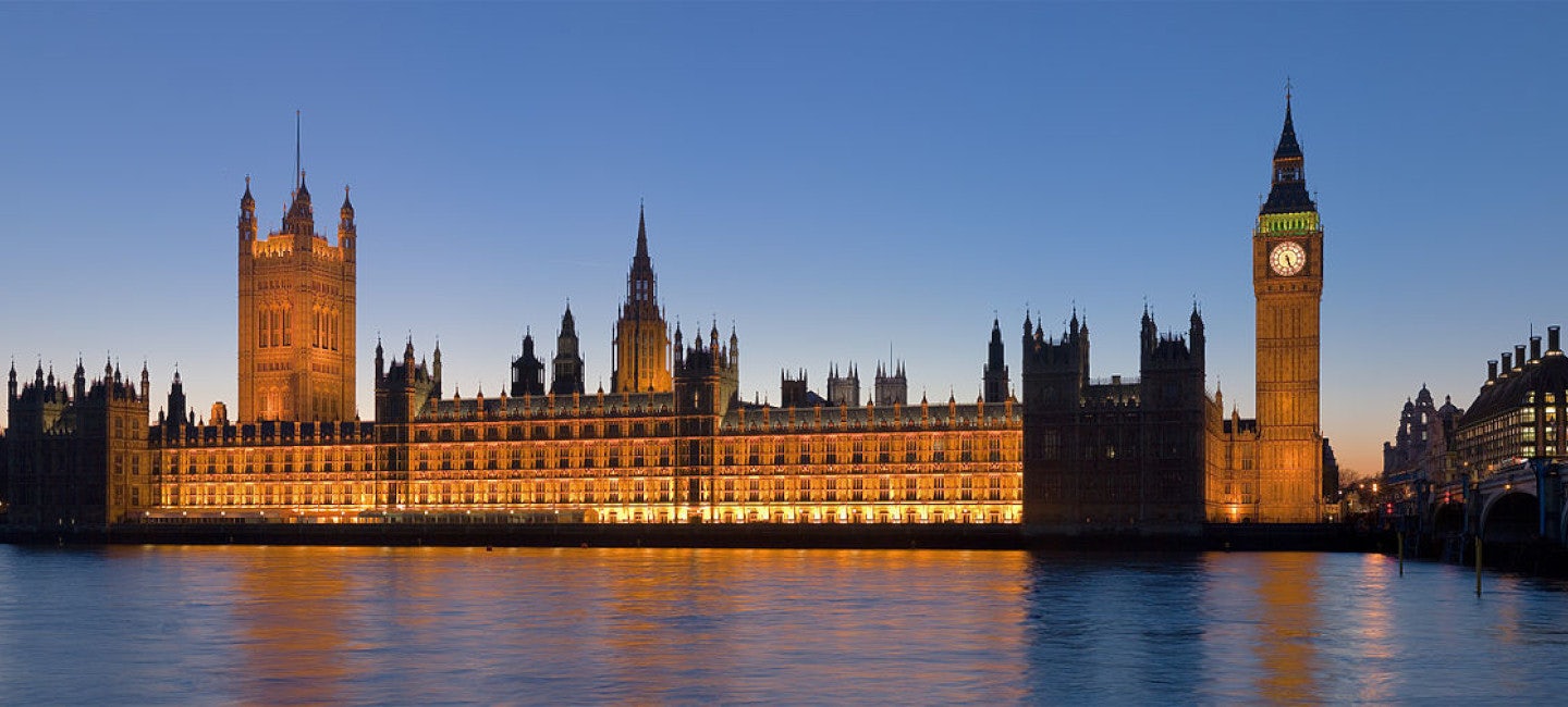 A captivating view of Westminster and the River Thames illuminated by the city's nightlights during the London Boat Show.