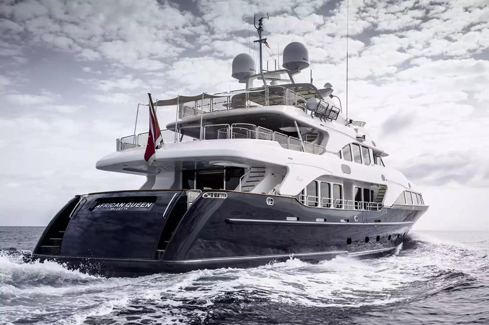 Side profile of luxury yacht AFRICAN QUEEN on the water