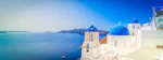 traditional greek village Oia of Santorini, with blue domes against sea and caldera, Greece, web banner with sunshine
