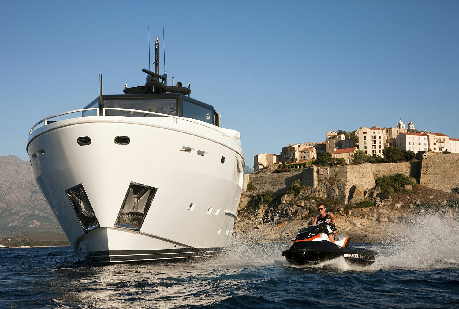Arcadia 115 yacht with a jet ski going by Arcadia 115 yacht with a jet ski going by
