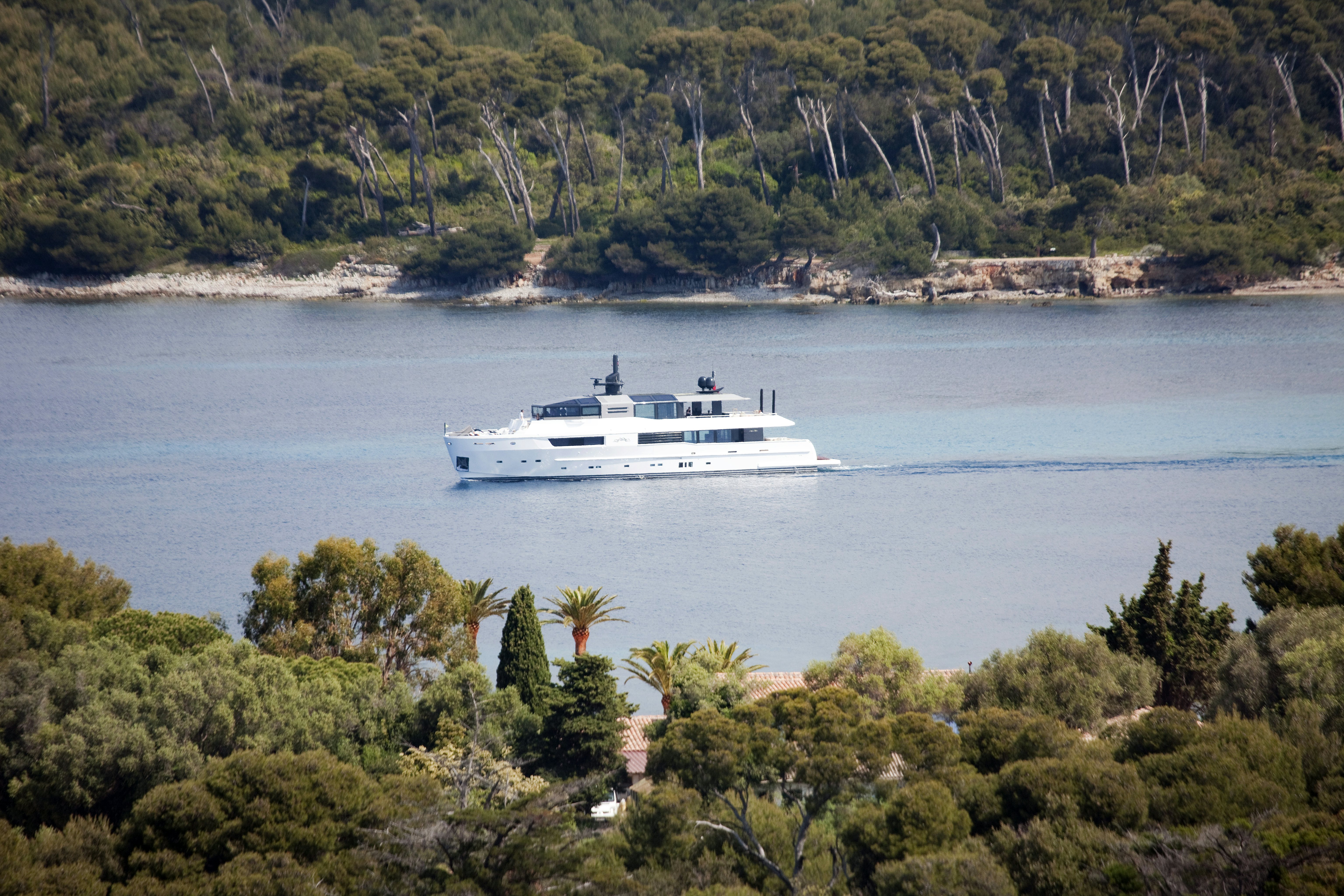 Arcadia yachts yacht cruising in the ocean surrounded by forst