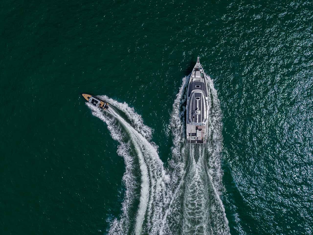 Aerial view of an explorer yacht with its tender