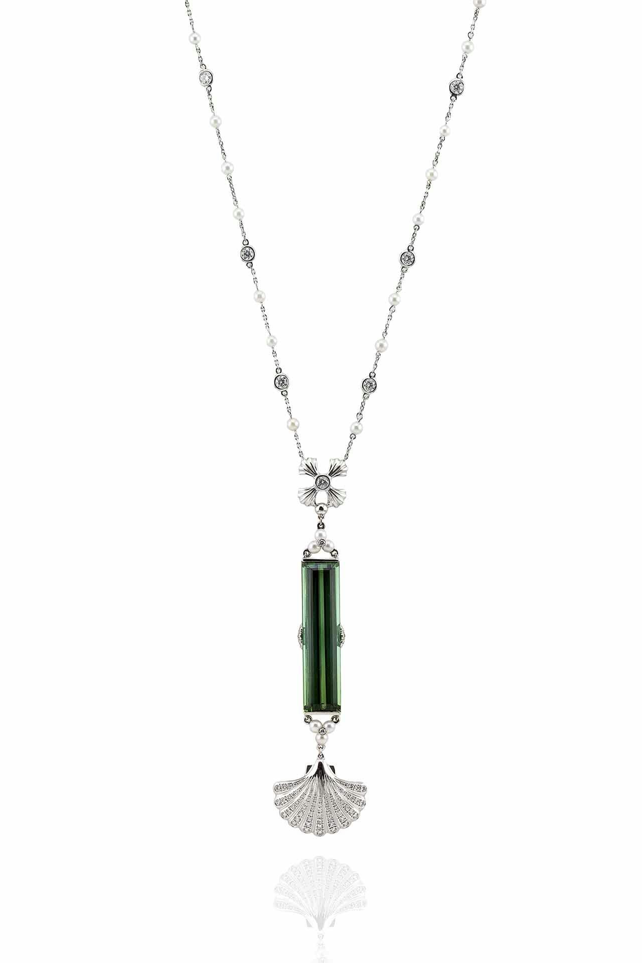 Green pendant necklace with a large diamond centered with a diamond-encrusted seashell