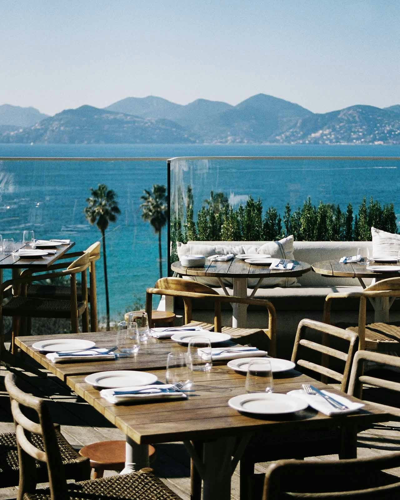 Dressed tables overlooking the Bay of Cannes