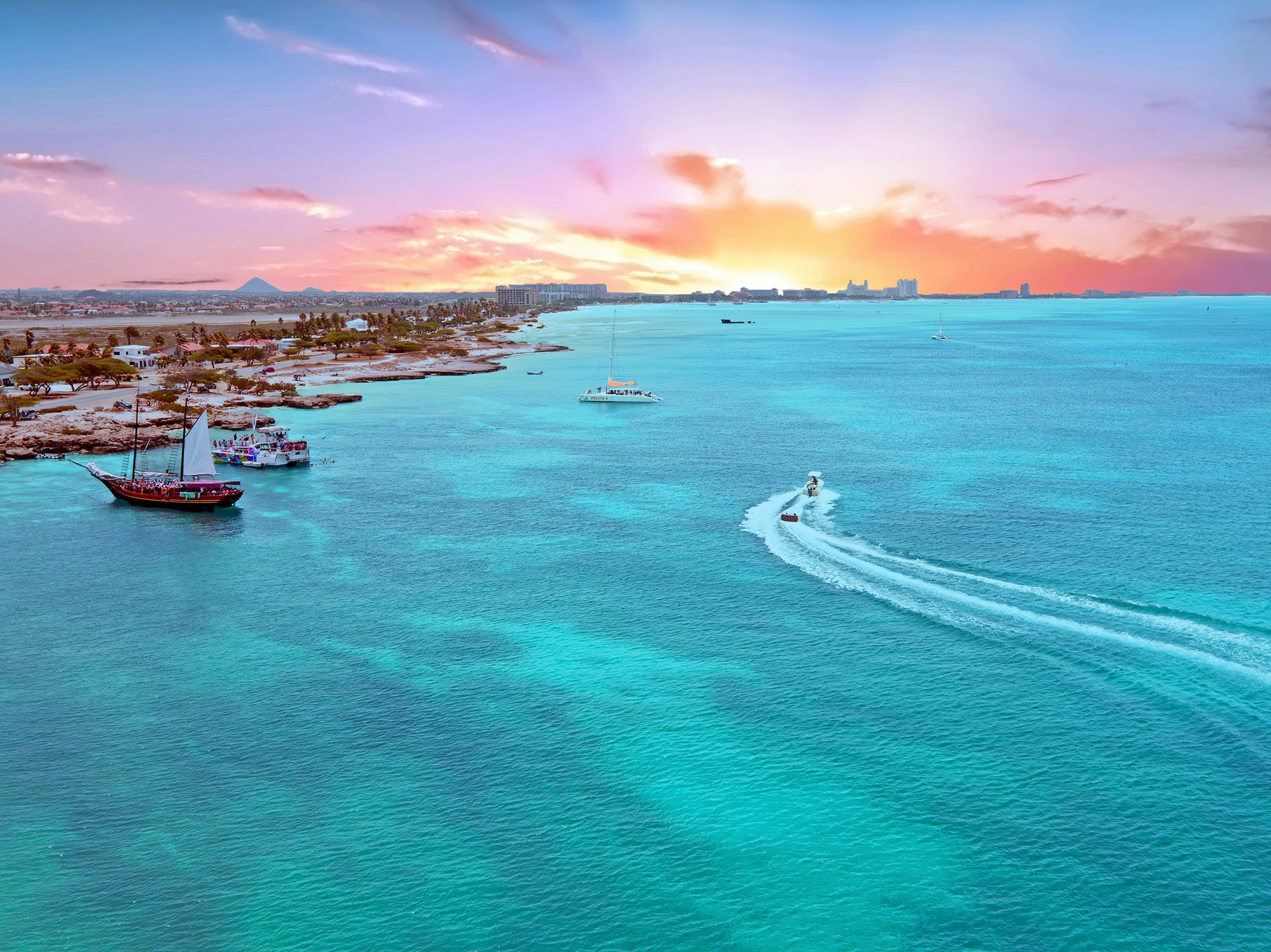 ABC Islands Luxury Yacht Charter - Aerial from Aruba island in the Caribbean Sea at sunset