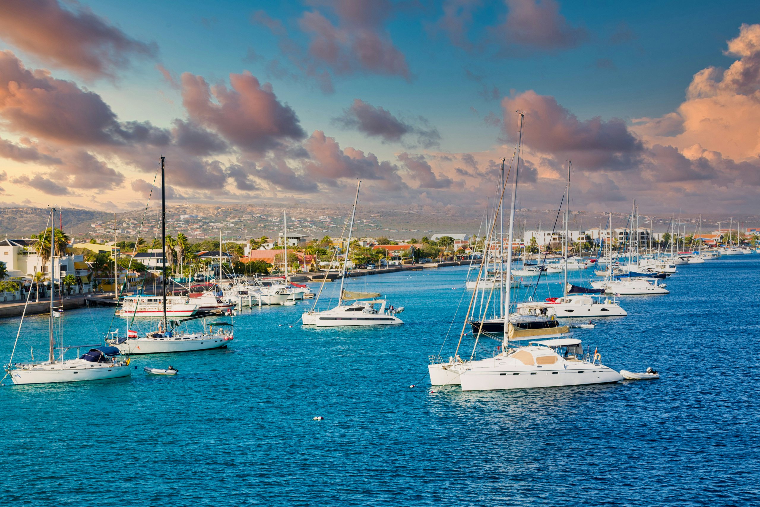 ABC Islands Charter Yacht - White yachts and sailboats moored off the coast of Bonaire