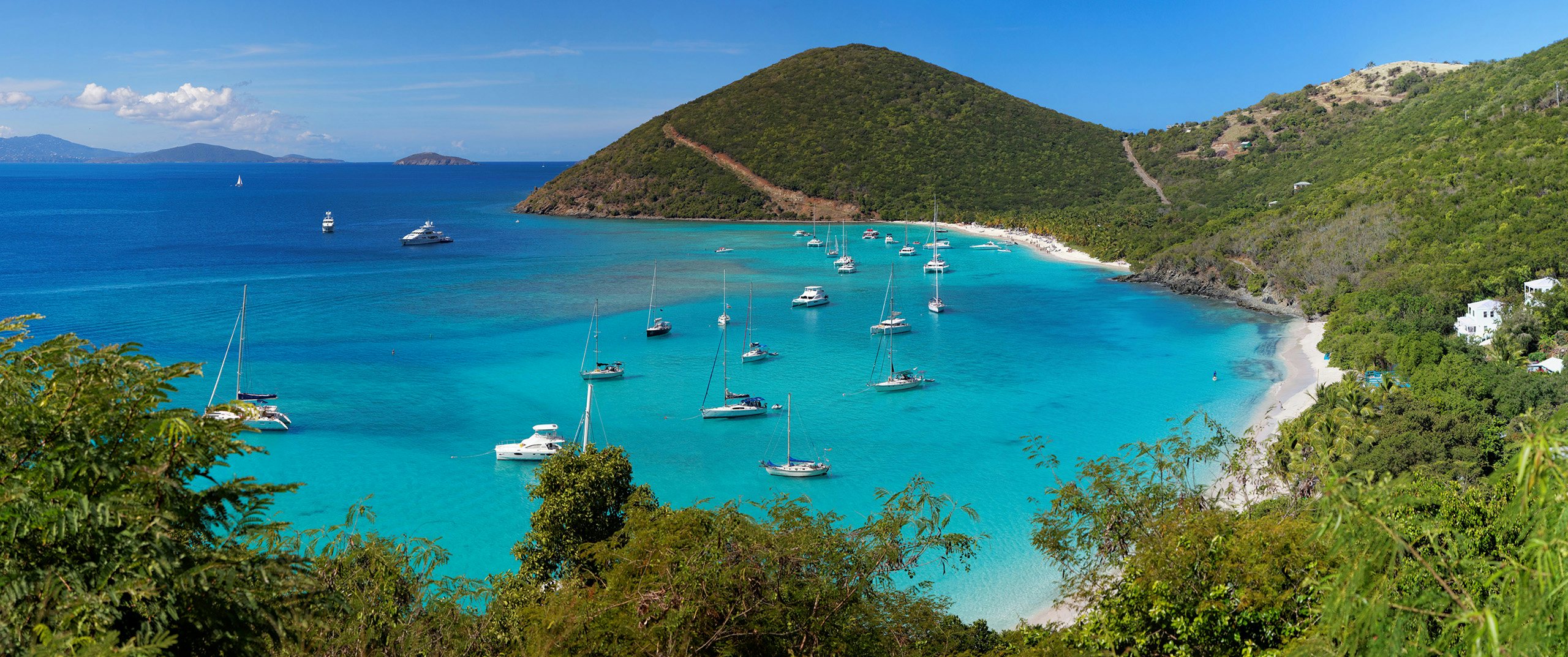 BVI Yacht for Charter: Panoramic View of Tropical Shoreline in the British Virgin Islands A breathtaking panoramic view of the tropical shoreline in the British Virgin Islands (BVI), Caribbean—a perfect scene for your Yacht Charter adventure.