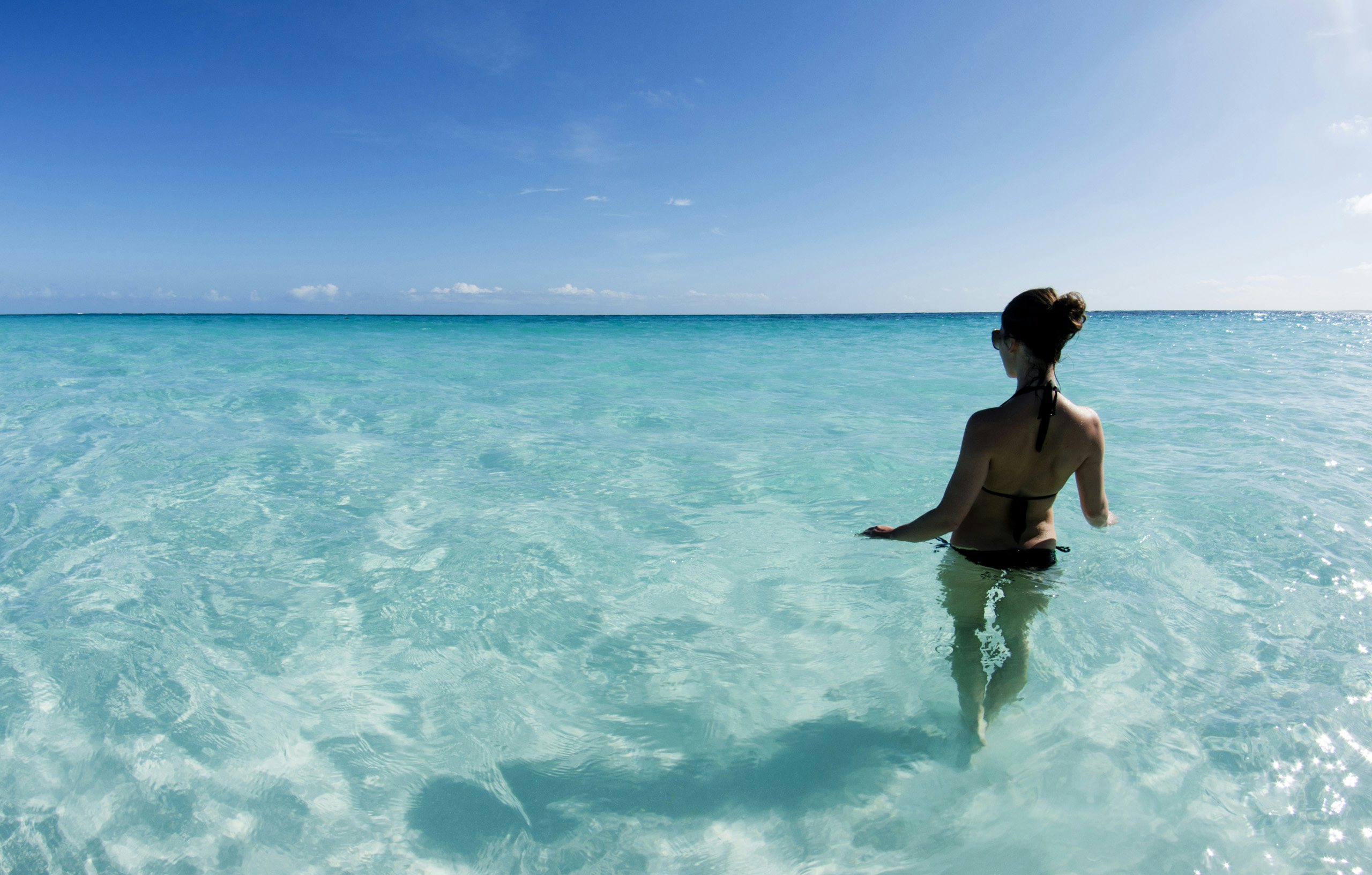 Turks & Caicos  Crewed Yacht Charter -Caribbean_Turks and Caicos_Salt Cay_Woman in Water Turks & Caicos Crewed Yacht Charter -woman at salt cay in the water in Turks and Caicos