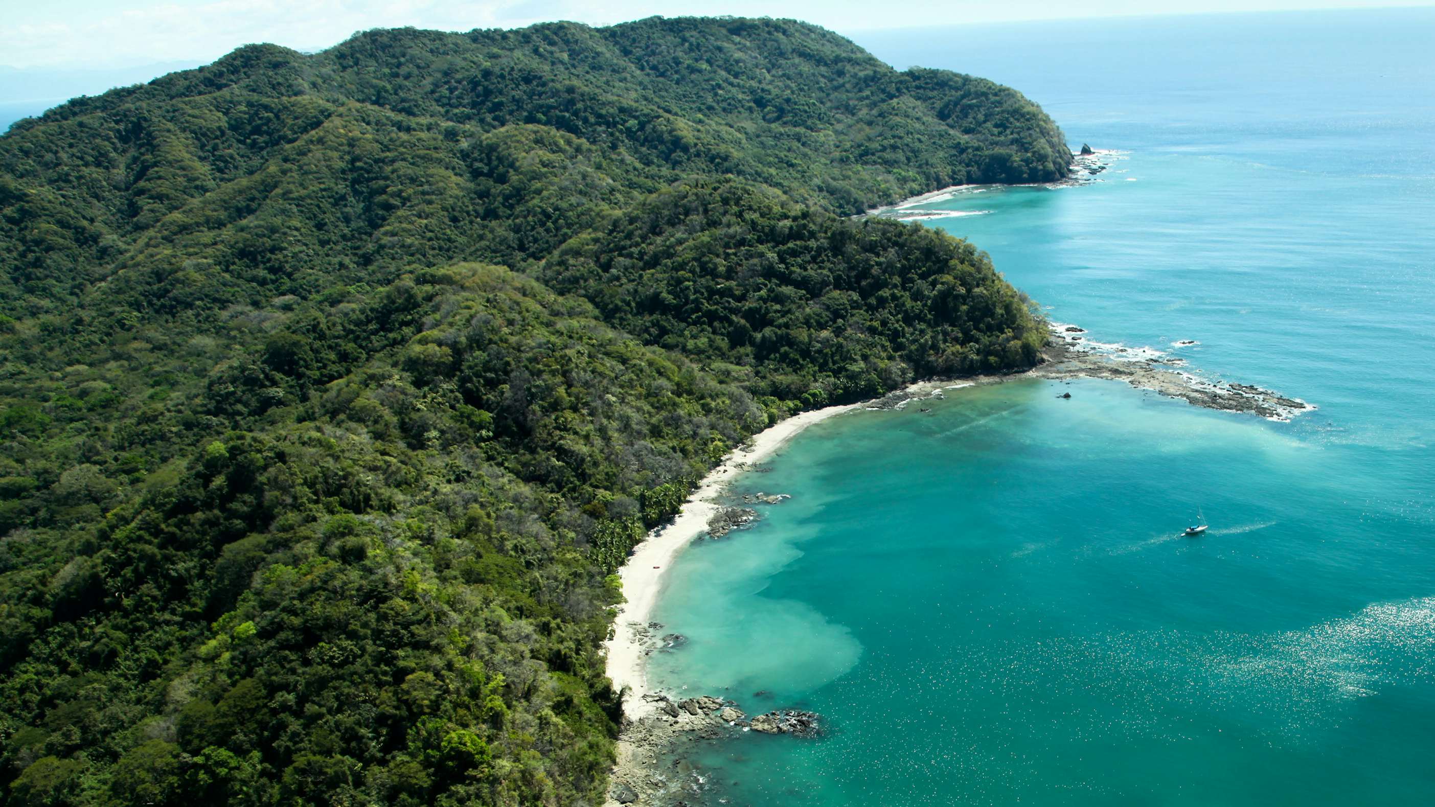 Costa Rica Crewed Yacht Charter -Ballena Bay, Costa Rica, Central America , aerial view of lush mountain landscapes and blue water