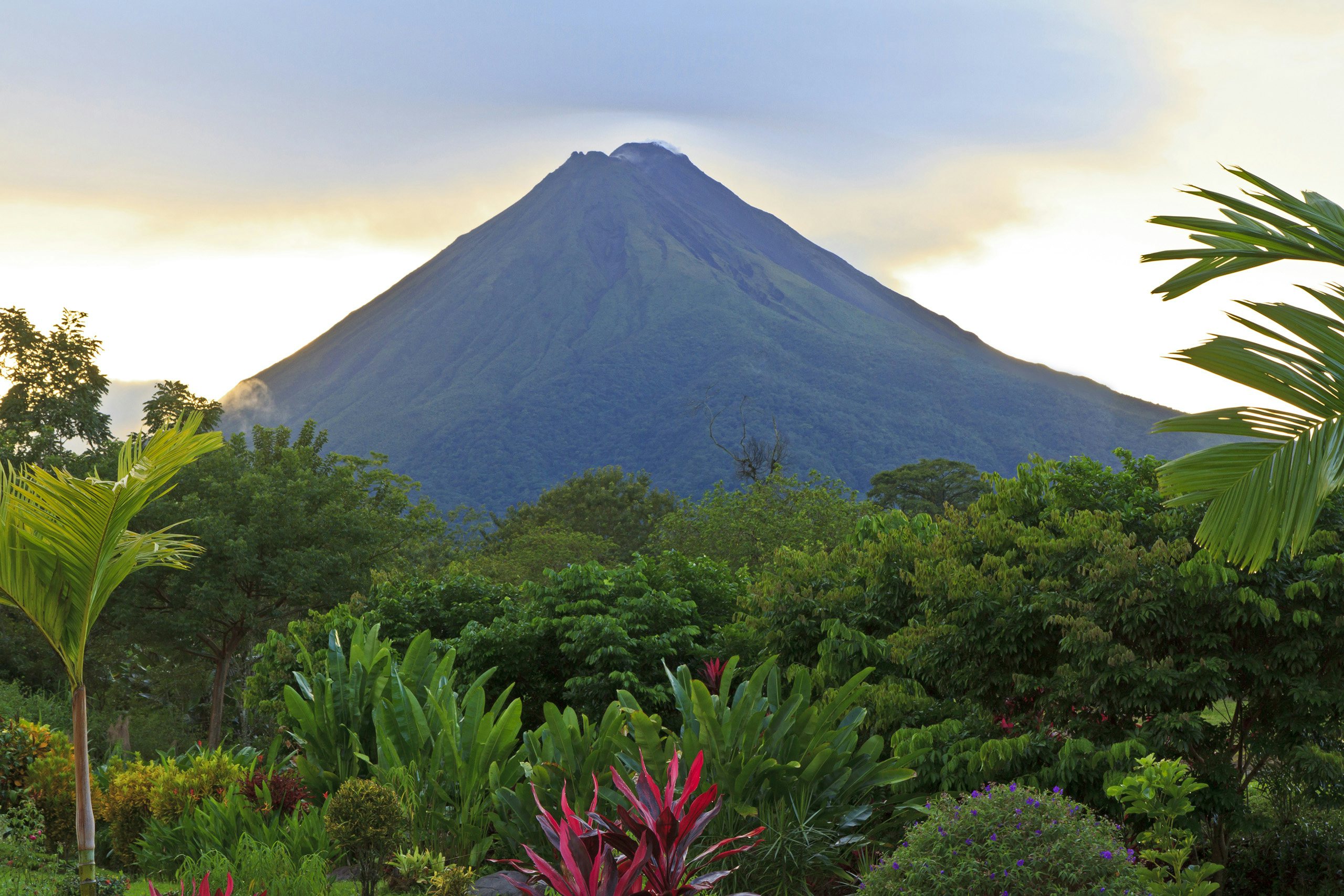 Costa Rica Luxury Yacht Charter - Central America_Costa Rica_La Fortuna_with Arenal Volcano Costa Rica Luxury Yacht Charter - La Fortuna with Arenal volcano, sunset behind the volcano surrounded by greenery