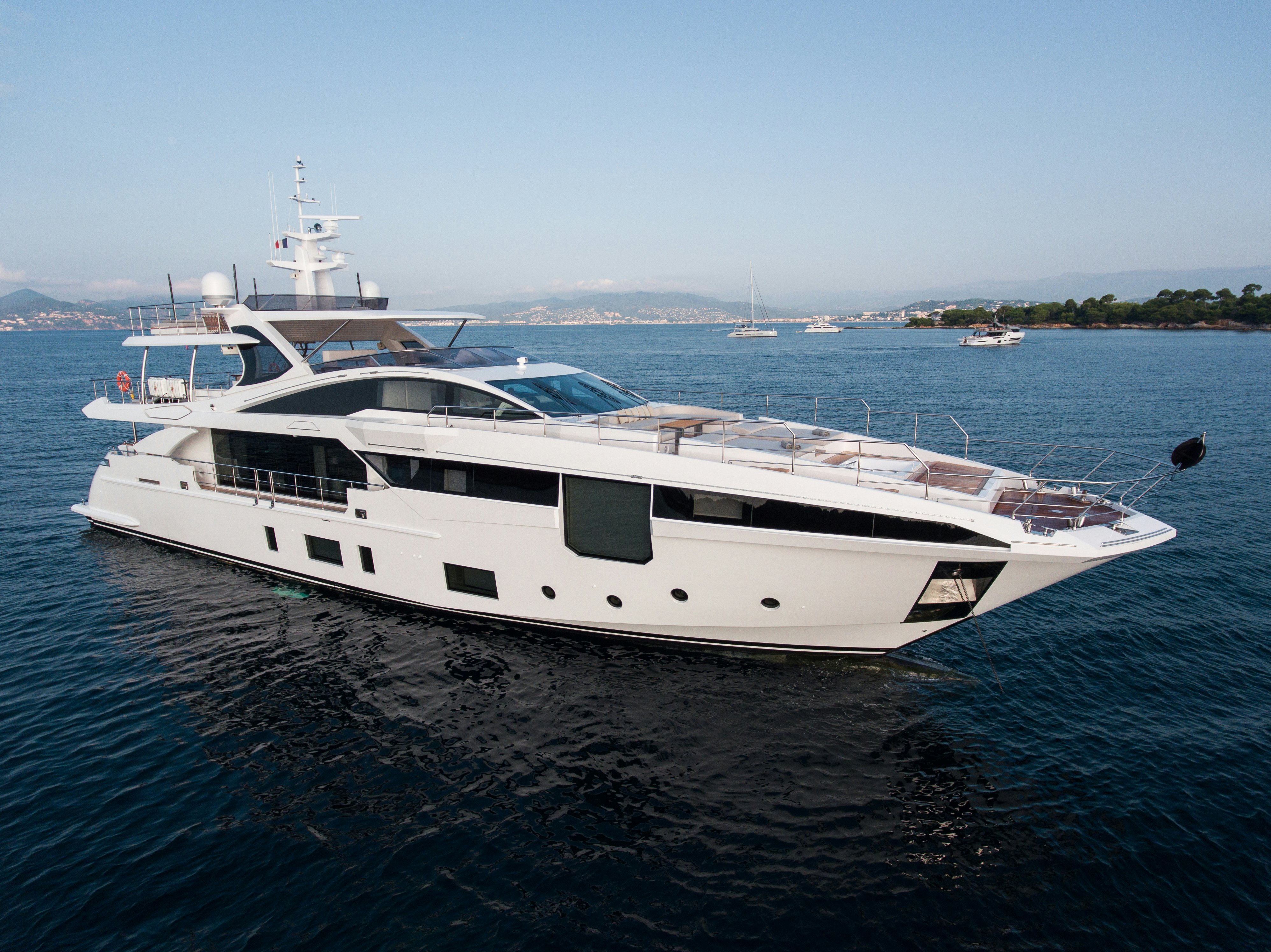 White yacht heed anchored in the dark blue ocean