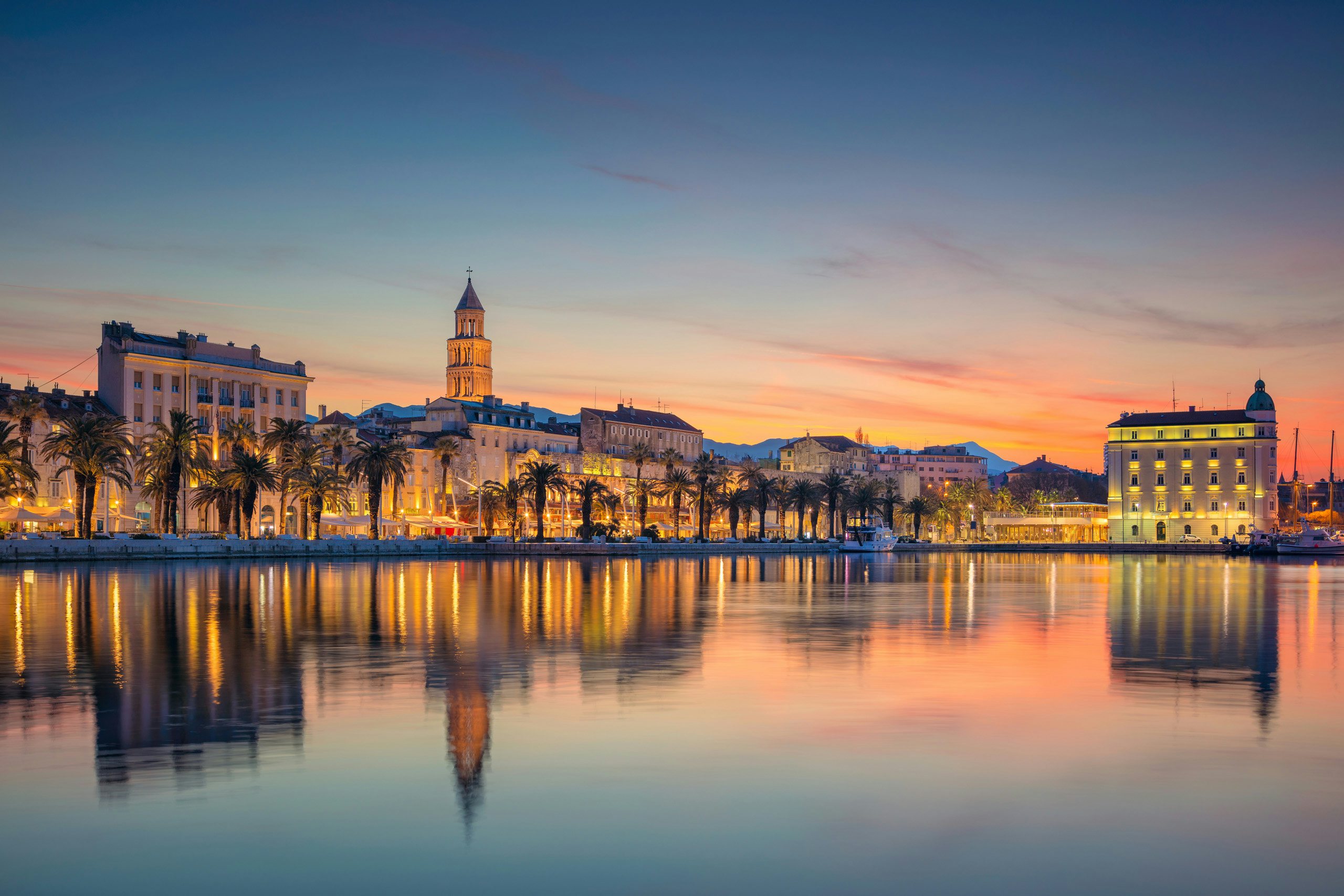 Stunning sunset over Split's waterfront, captured from a luxury yacht charter in Croatia.