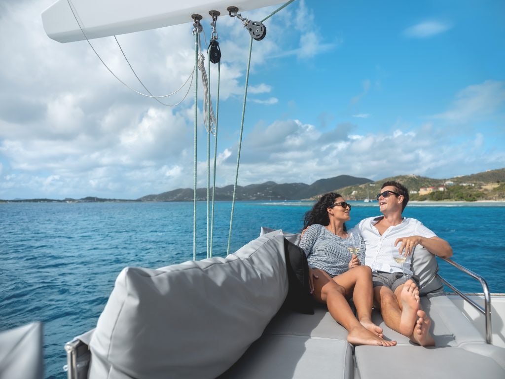 Couple lounging on a sailing yacht