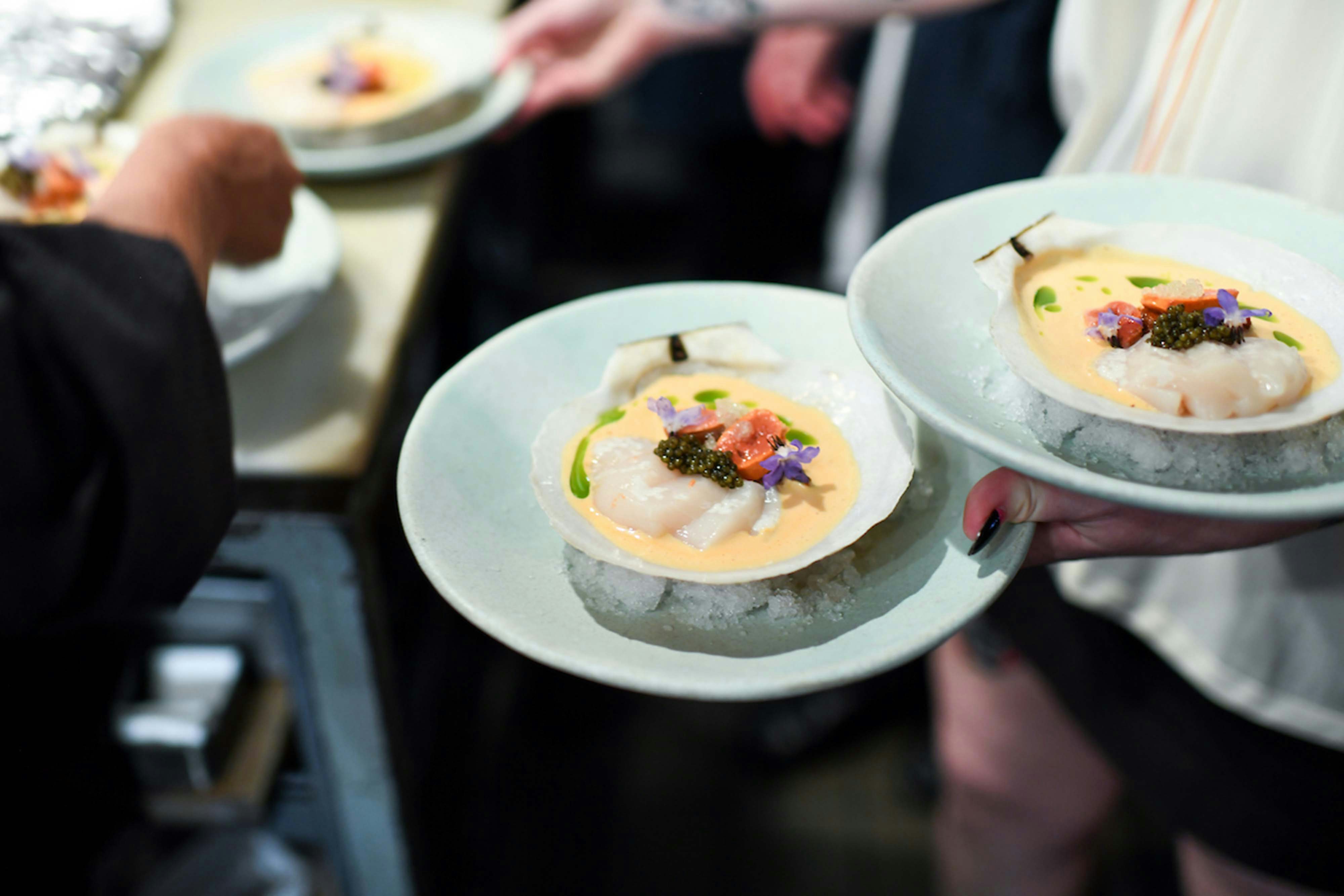 Impression Makers Supper Club close up image of the fine dining cuisine offered, fancy food on plates being served