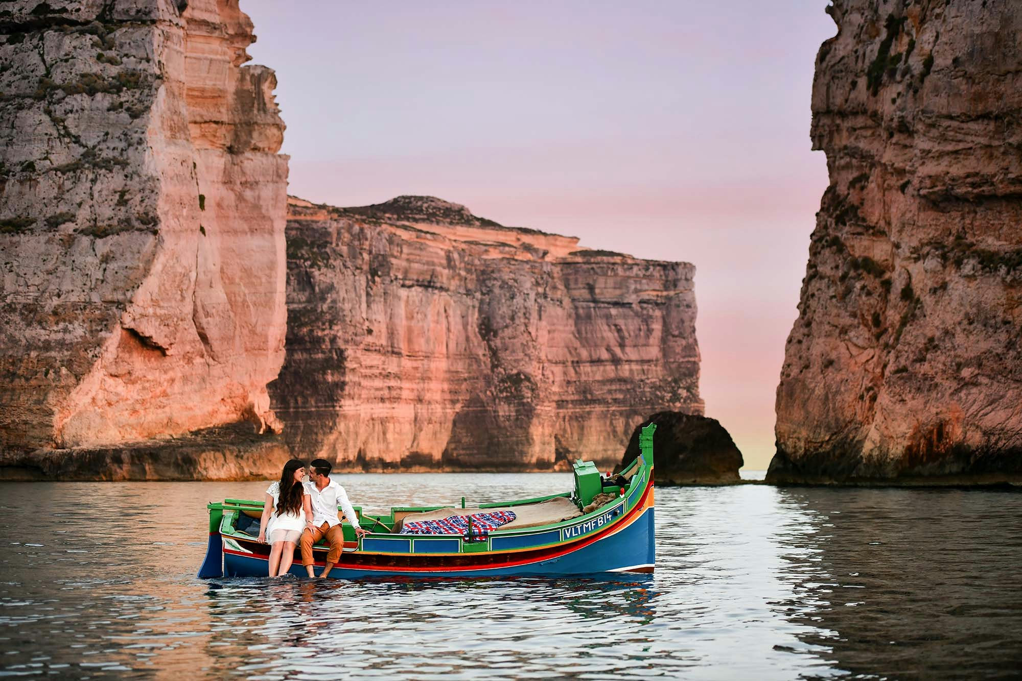 Dwejra Bay, San Lawrenz, Gozo romantic image of a couple in a boat