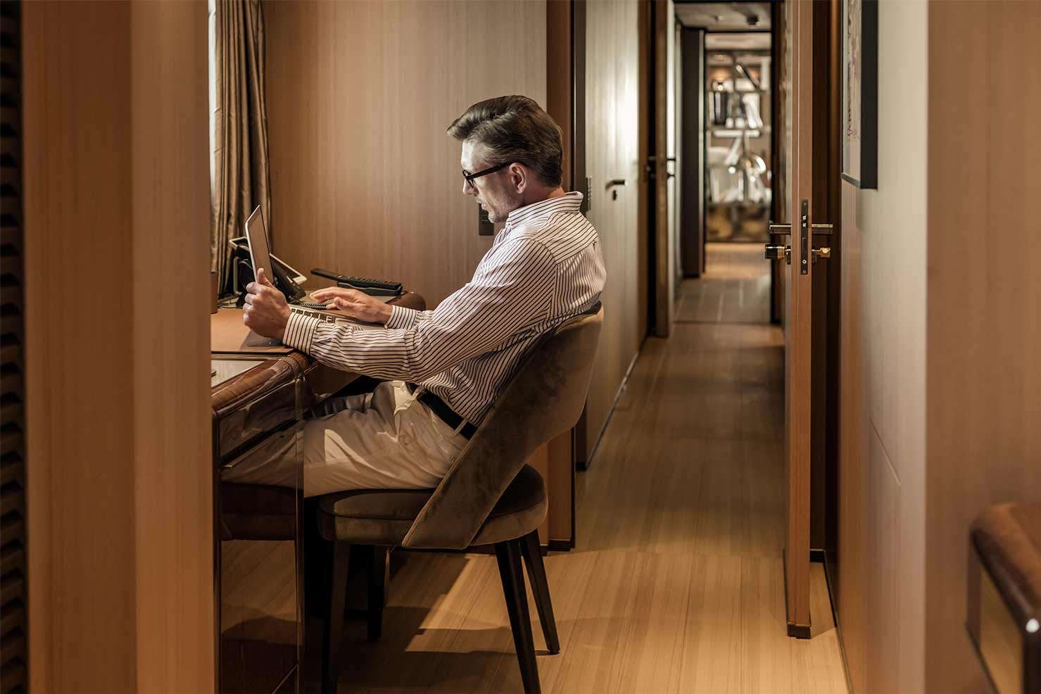 man in office aboard VERTIGE