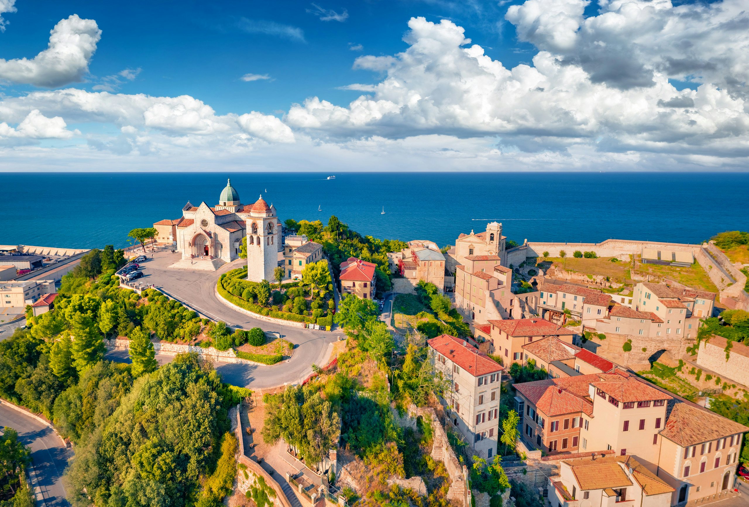 Ancona Yacht Charter - Bright summer view from flying drone of Cattedrale di San Ciriaco church and San Gregorio Illuminatore - Catholic church. Stunning morning cityscape of Ancona town, Italy, Europe.