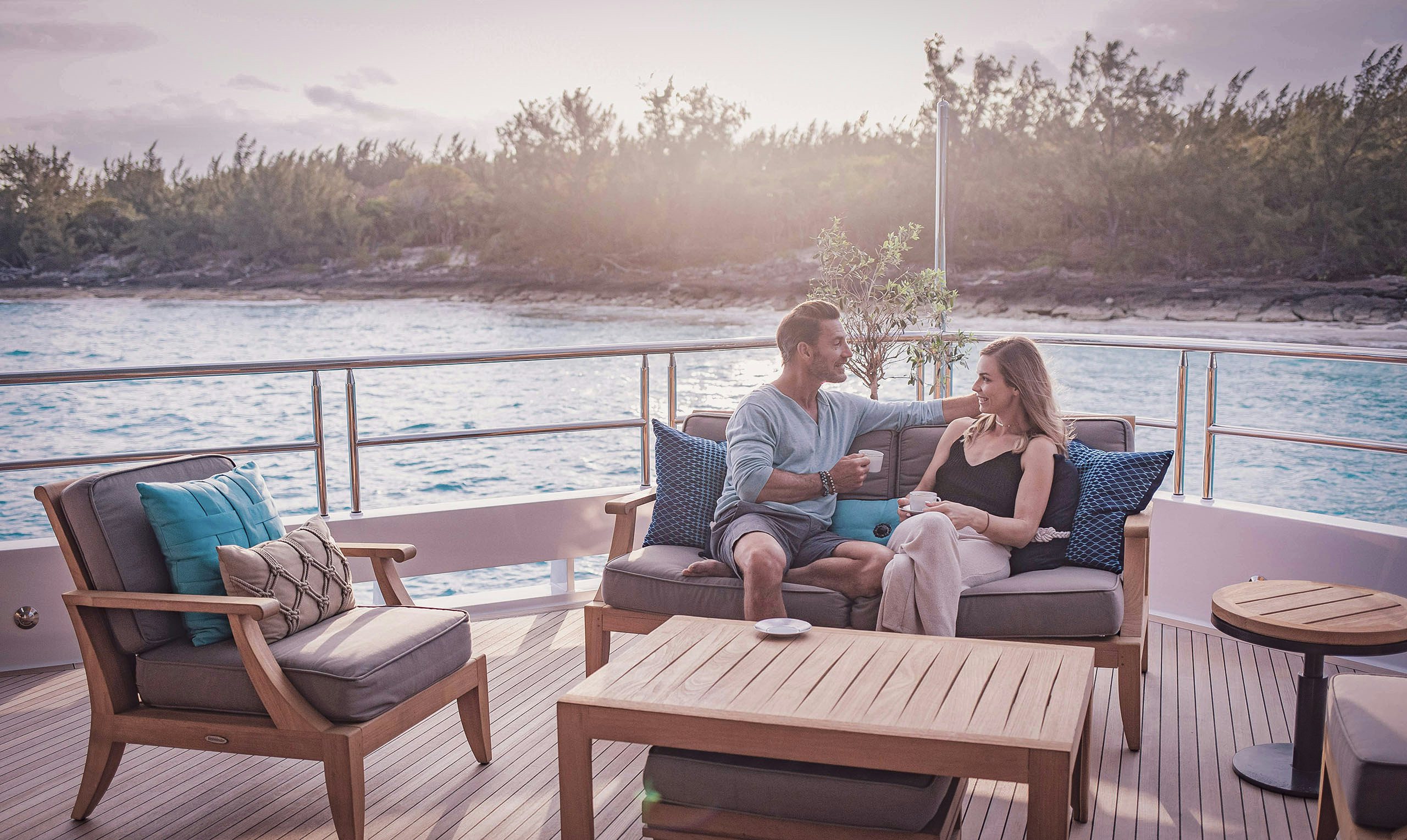 Familiarization Trips Couple enjoying coffee on board charter yacht