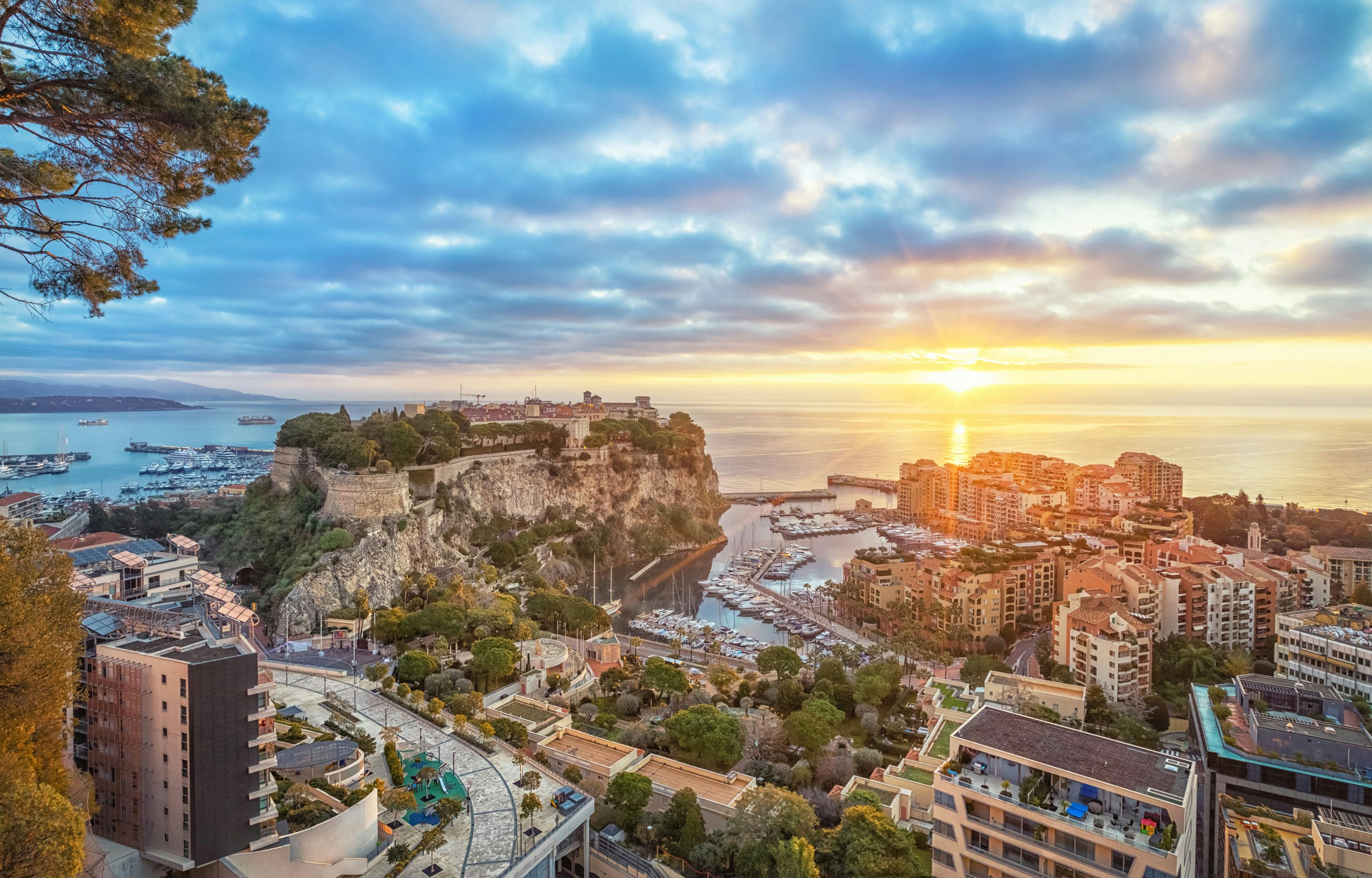Monaco Sunset Sailing - Yacht Charter Elegance Redefined Sunset view over the lavish cityscape of Monaco, a premier destination for luxury yacht charters on the French Riviera