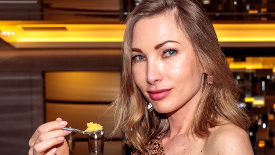 Lady eating caviar