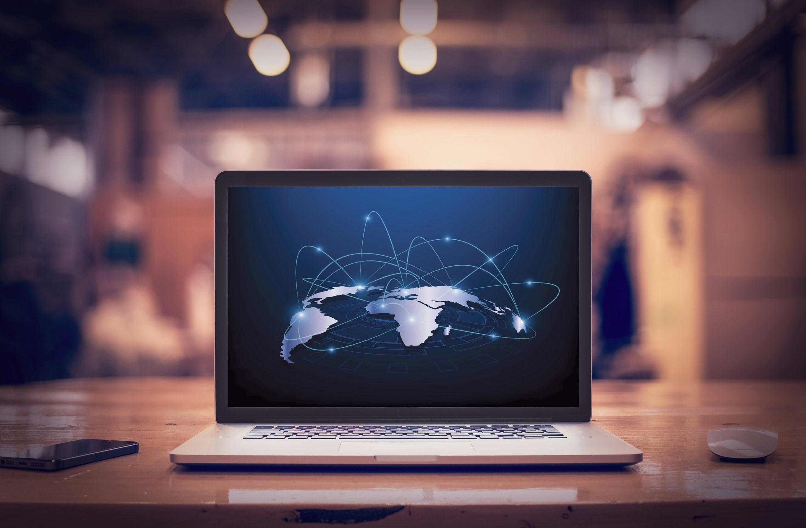 Global Database Laptop with world map showing connections