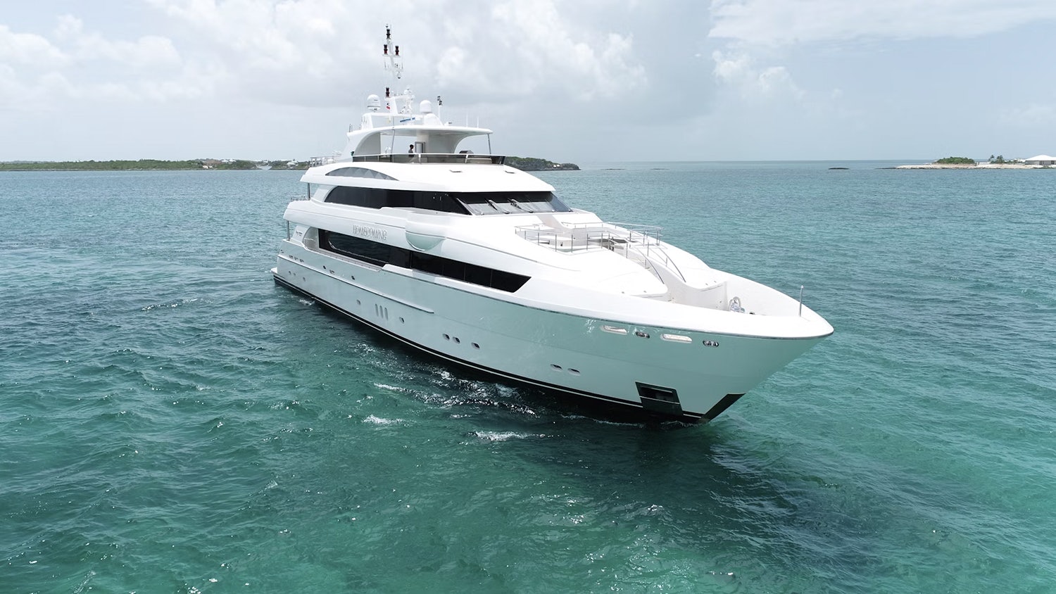 HOMECOMING white yacht in the blue ocean