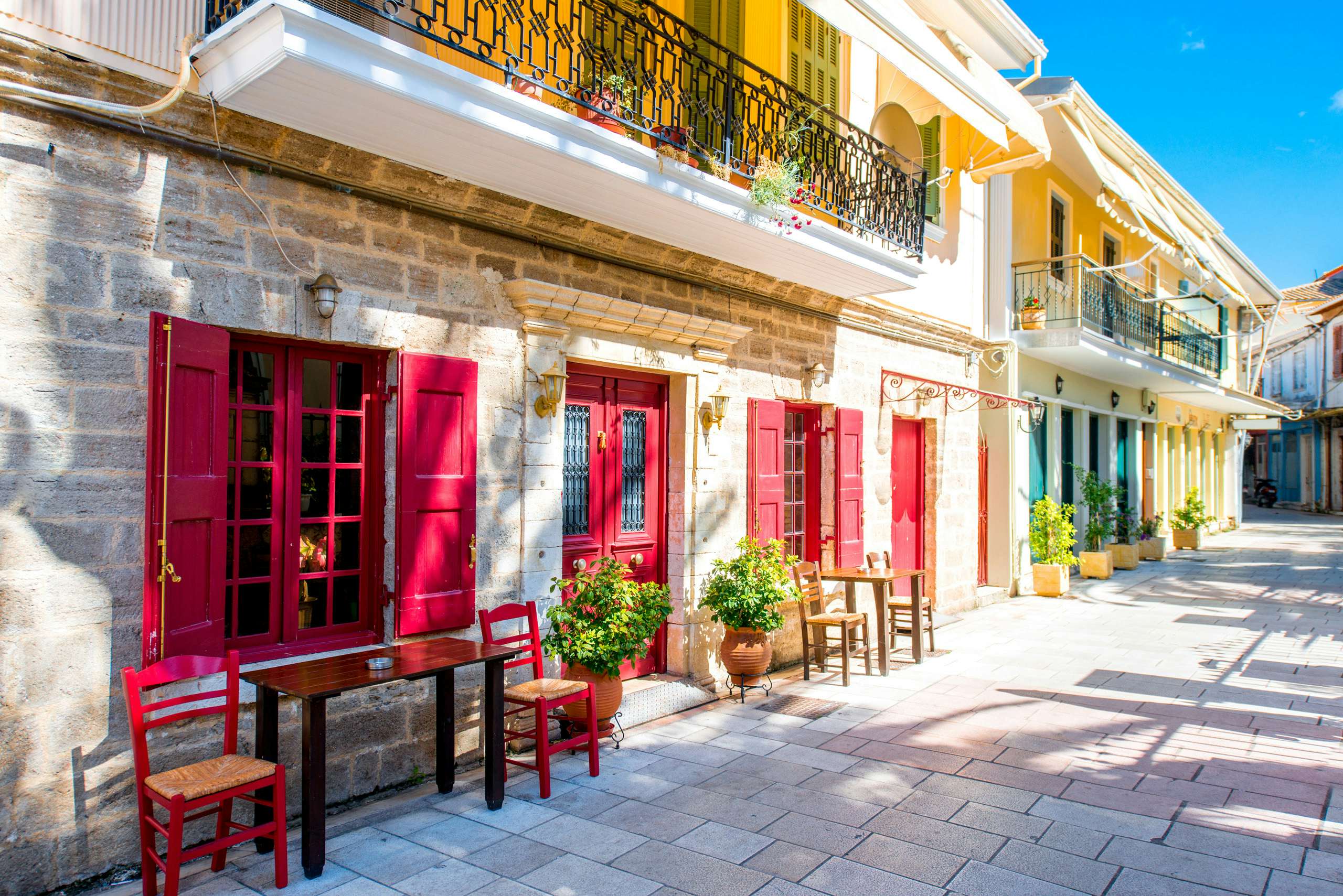 Colorful facades of Levkas town, reflecting the vibrant Greek culture, perfect for a leisurely yacht charter stop.