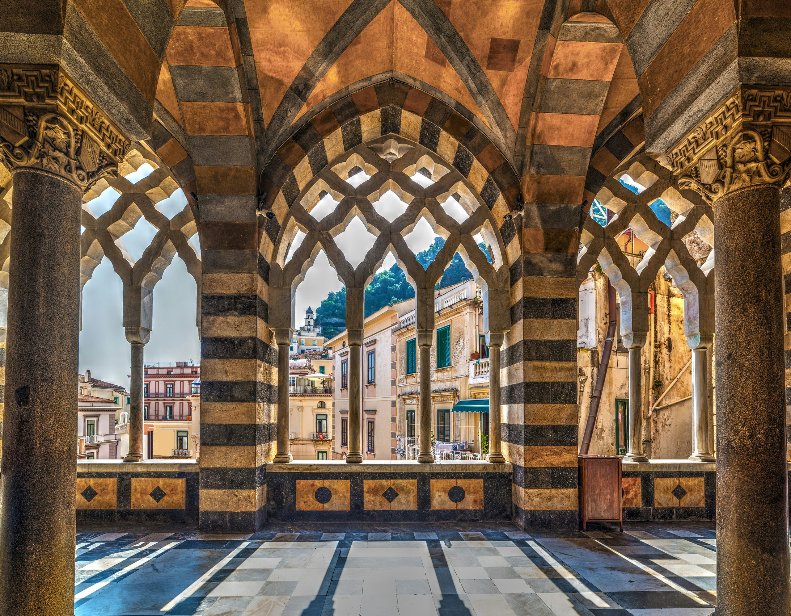 Discover Campania Cathedral | Amalfi Coast Yacht Charter | Northrop & Johnson Ornate Gothic architecture of Campania Cathedral's interior in Amalfi, a must-visit during an Amalfi Coast yacht charter.
