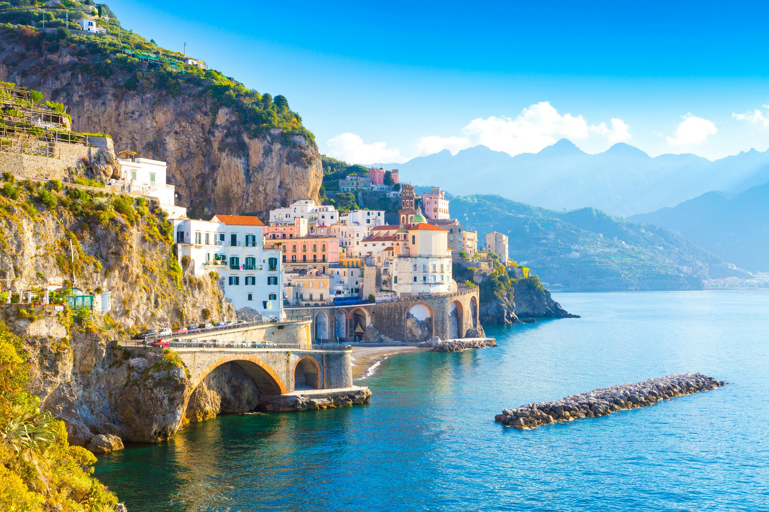 Serene Sorrento Escape | Amalfi Coast Yachting | Northrop & Johnson The coastal charm of Sorrento with cliffside buildings overlooking the tranquil sea.