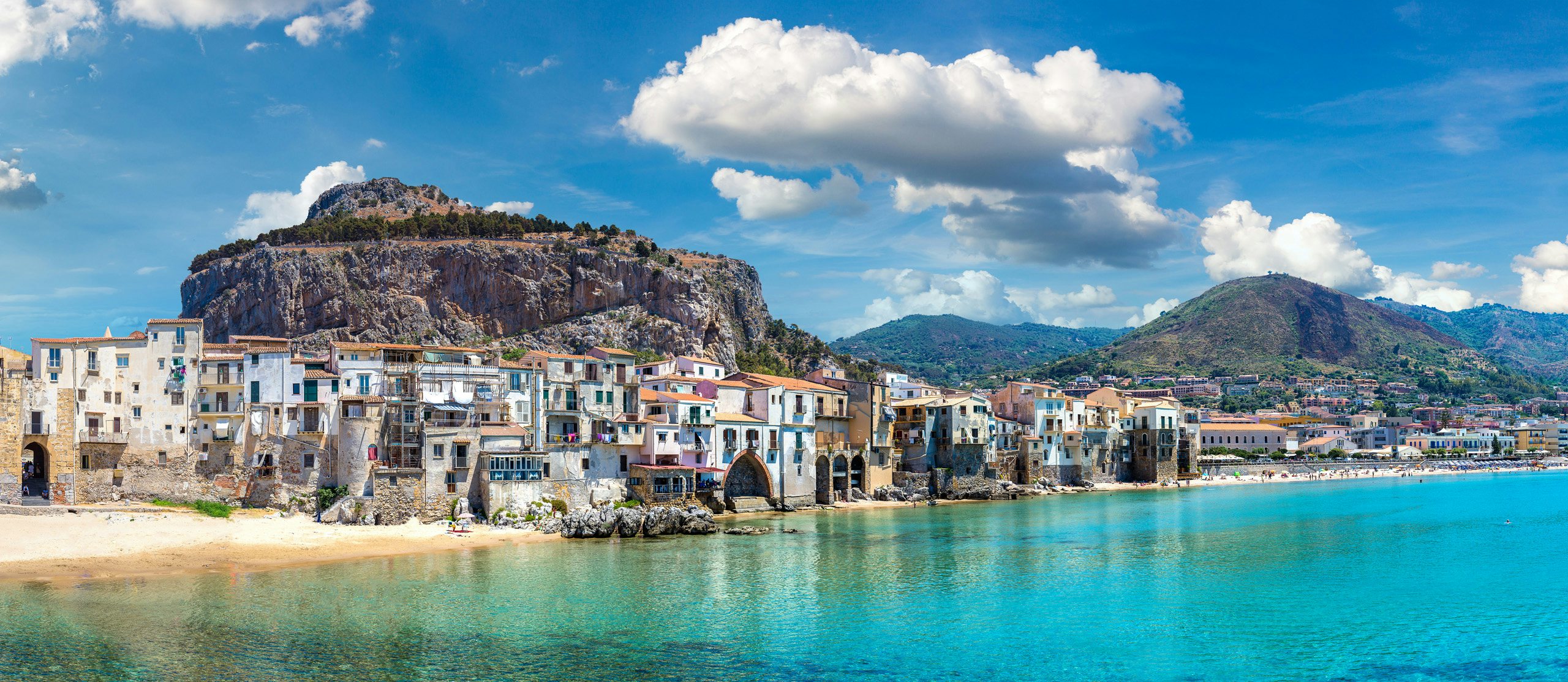 Yacht Charter Sicily - Panorama of Harbor and old houses in Cefalu in Sicily, Italy in a beautiful summer day