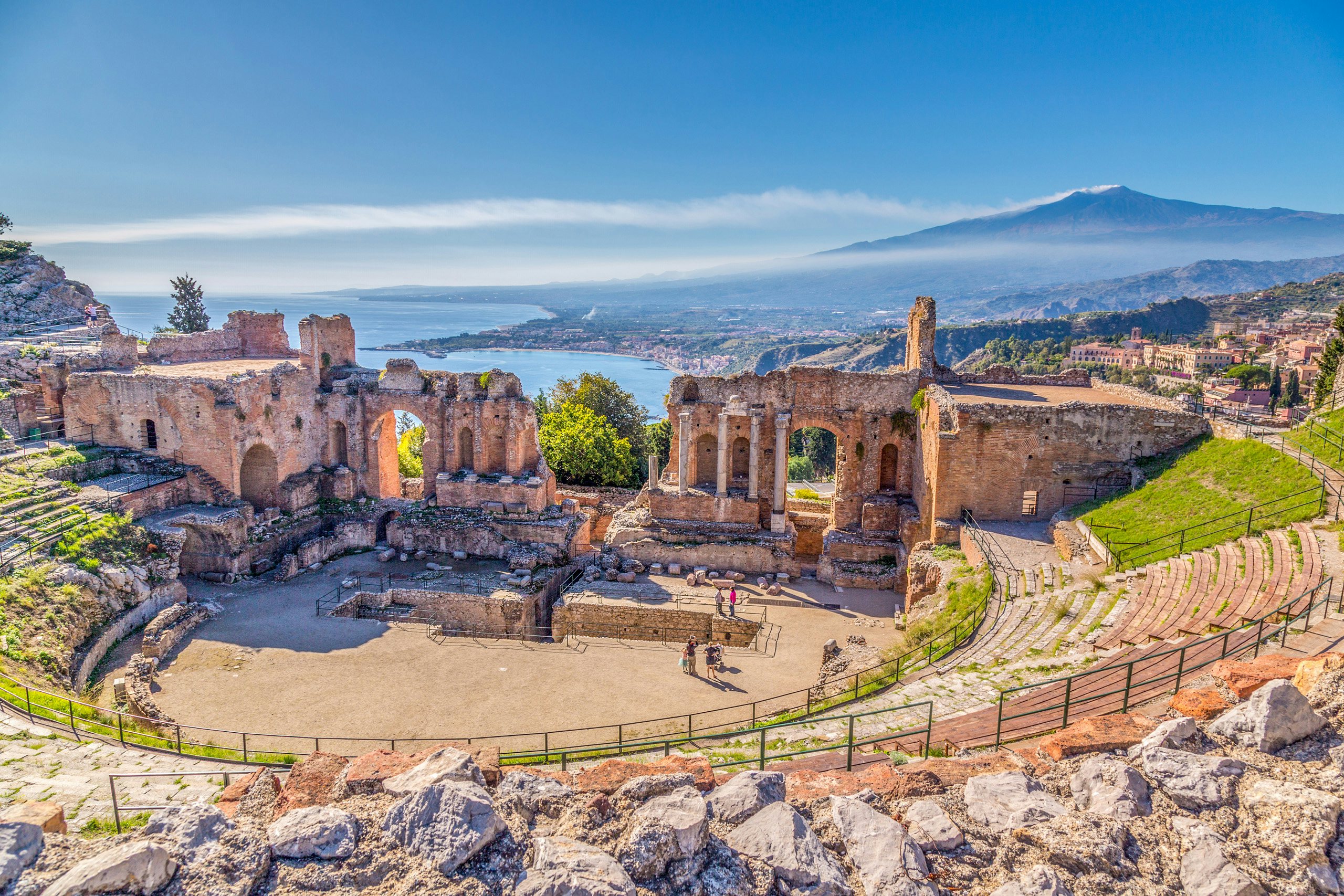 The ancient Greek theater of Taormina, Sicily, with a view of the sea, ideal for cultural exploration on a N&J yacht charter.