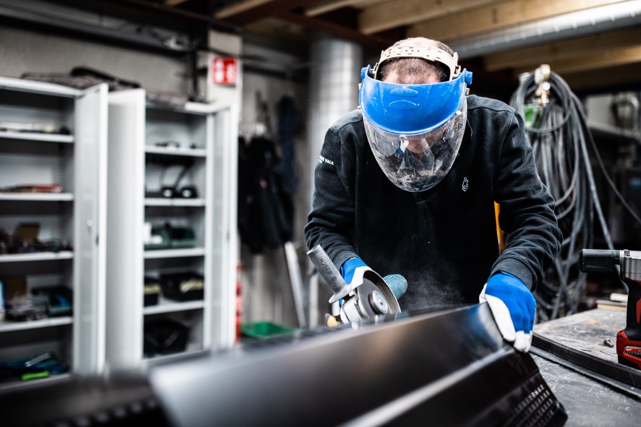 photo of a Van der Valk construction welder in action with equipment and protective gear