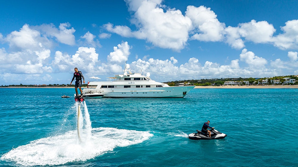 Side profile of LIONSHARE on the water.
