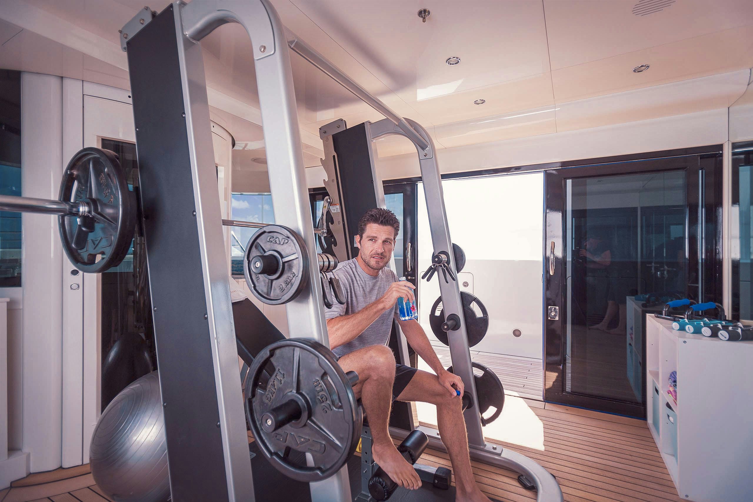 Gym on board charter yacht LUMIERE II in use during yacht charter